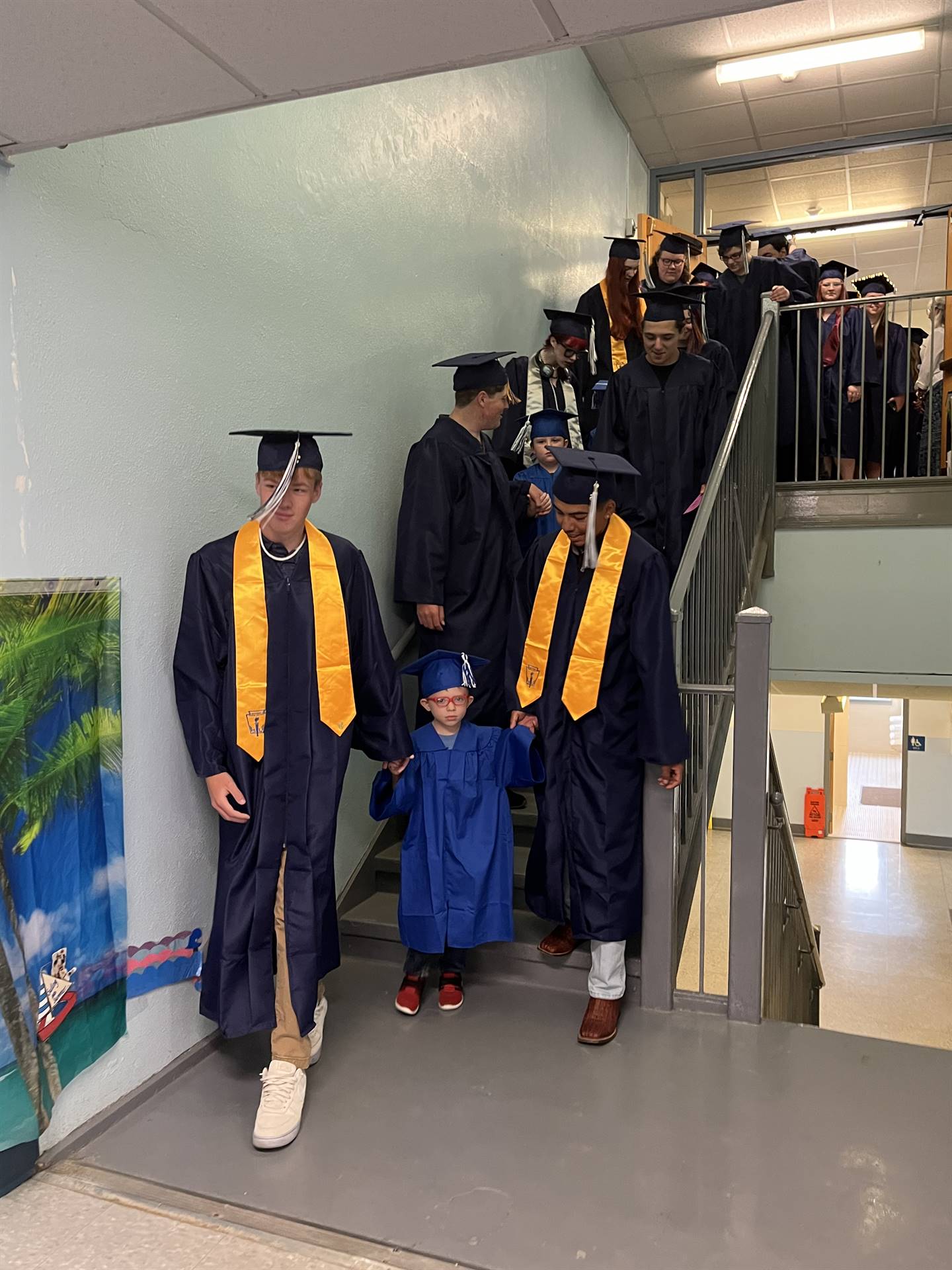 2023 Senior graduates in the hallway of their primary school