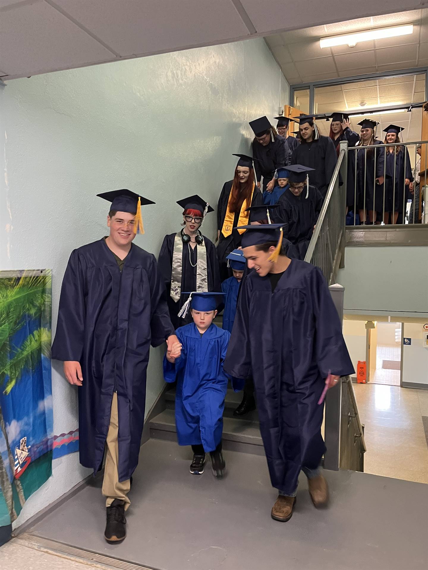 2023 Senior graduates in the hallway of their primary school with pre k graduates