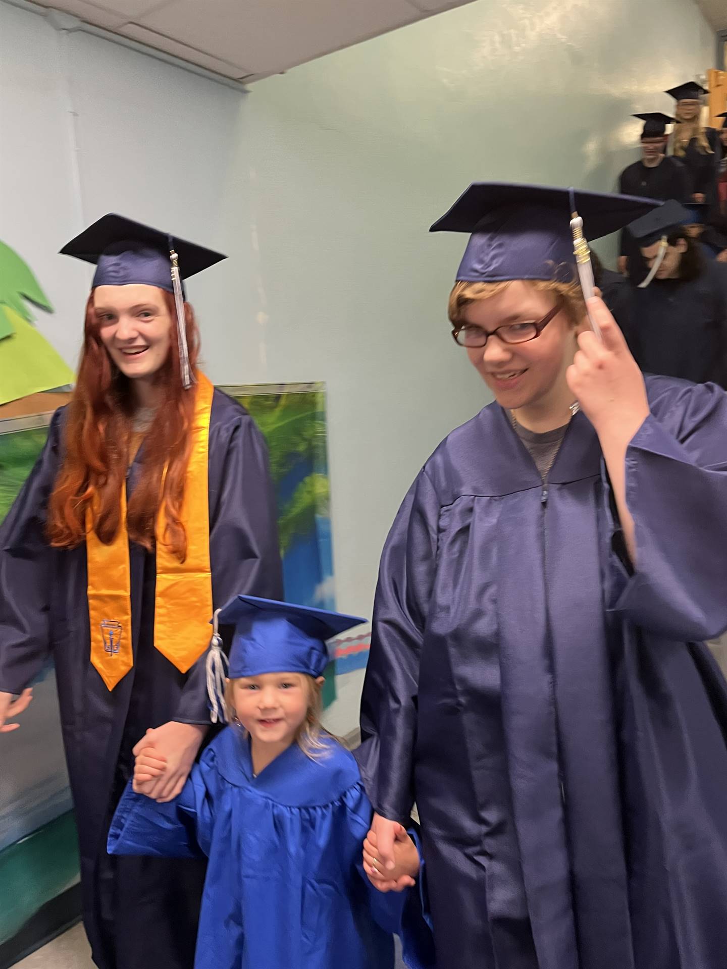 2023 Senior graduates in the hallway of their primary school