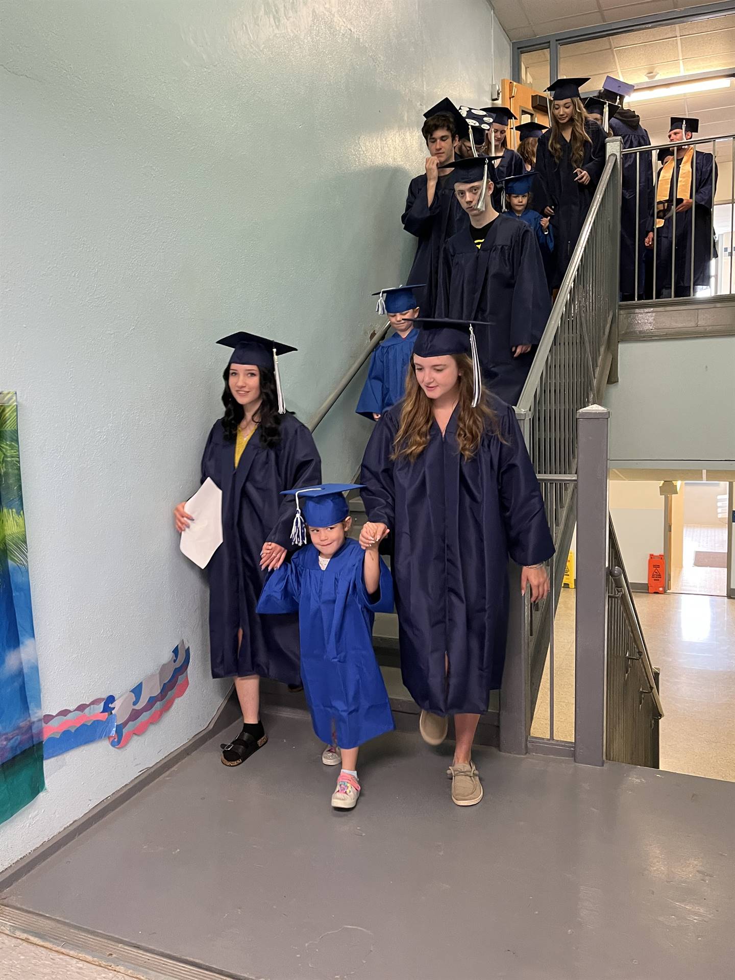 2023 Senior graduates in the hallway of their primary school