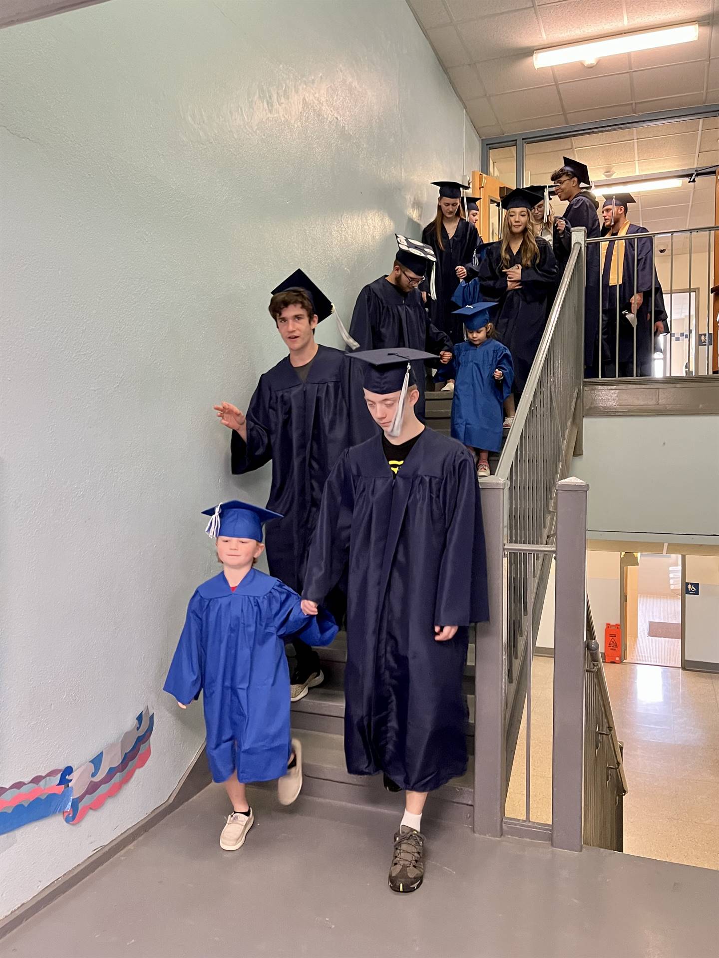 2023 Senior graduates in the hallway of their primary school