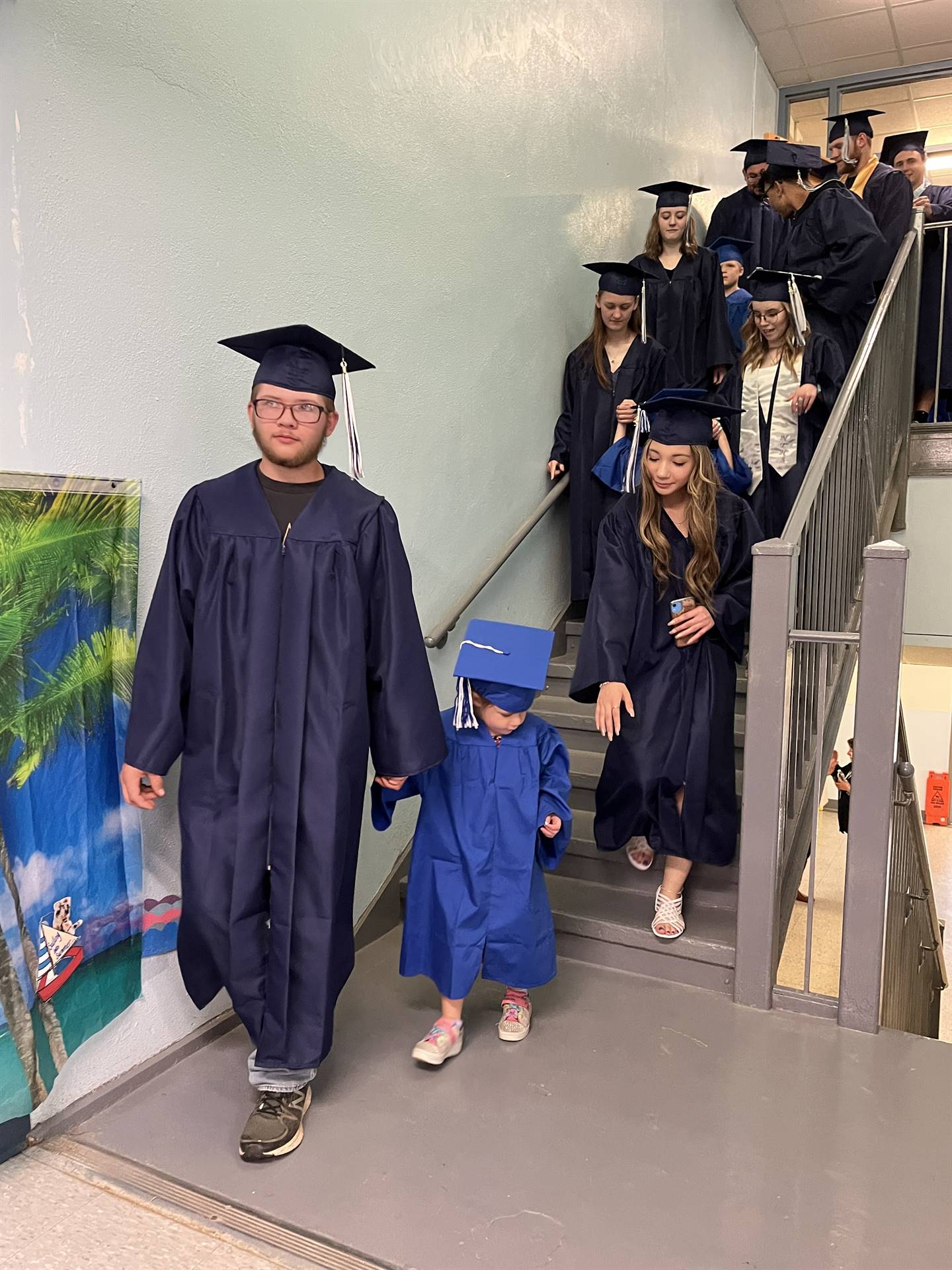 2023 Senior graduates in the hallway of their primary school