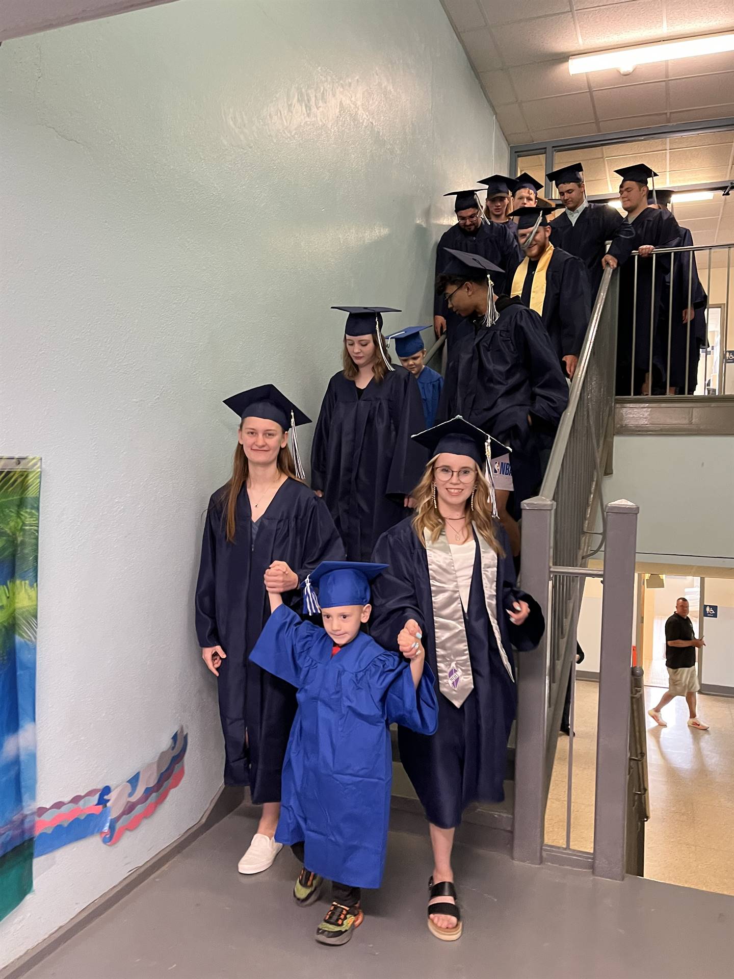 2023 Senior graduates in the hallway of their primary school