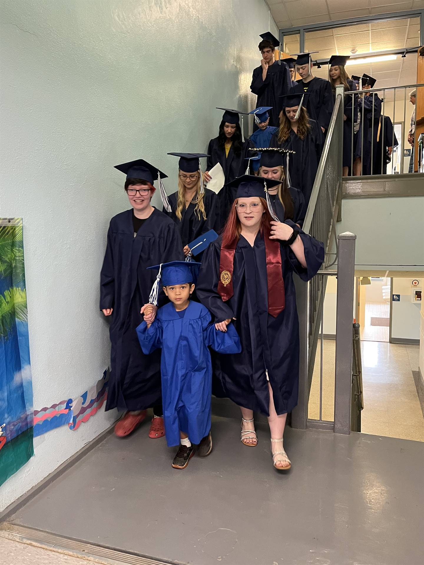 2023 Senior graduates in the hallway of their primary school