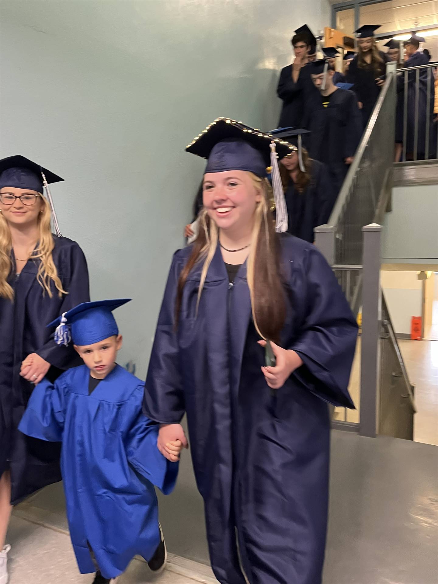 2023 Senior graduates in the hallway of their primary school