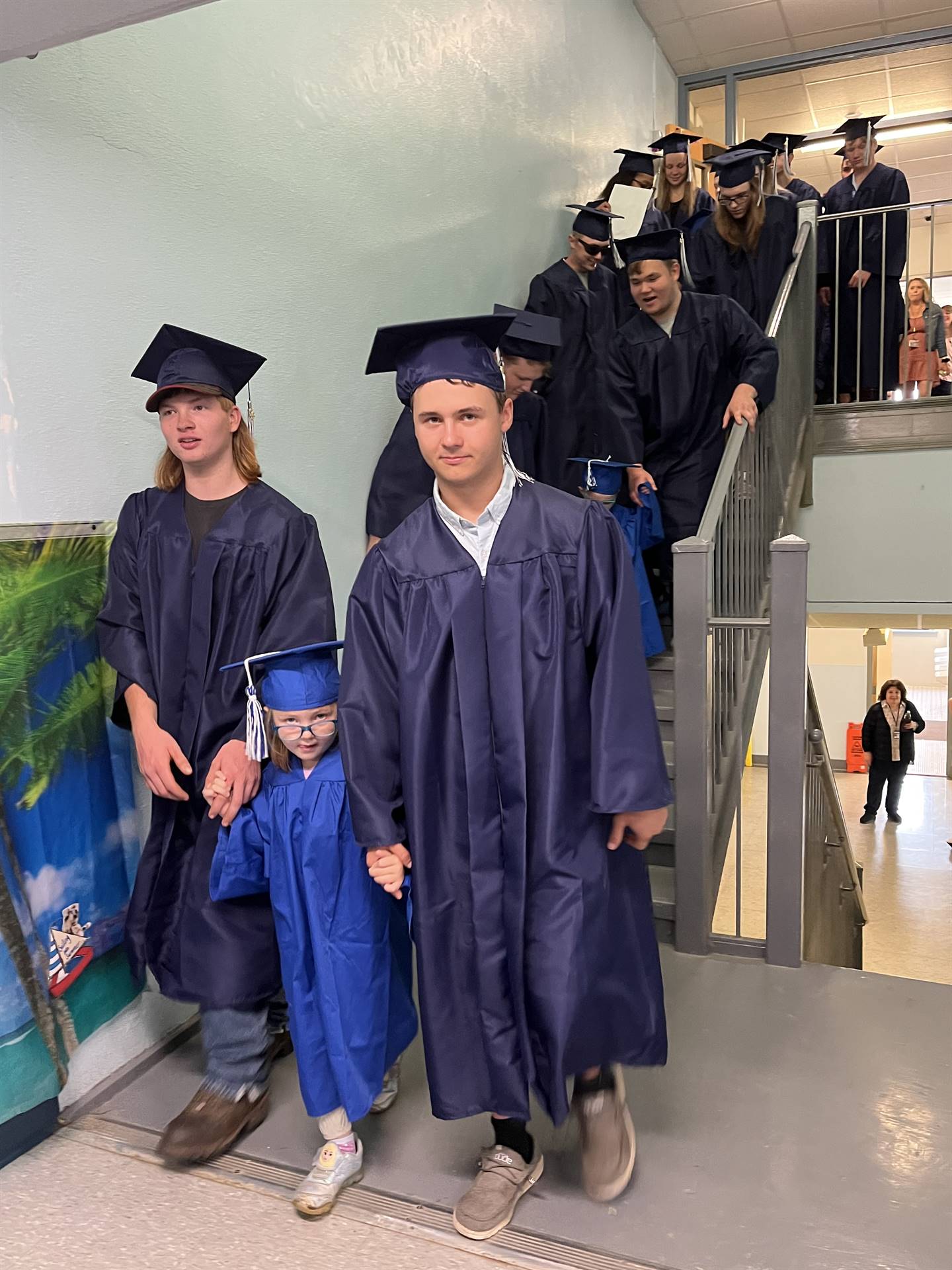 2023 Senior graduates in the hallway of their primary school