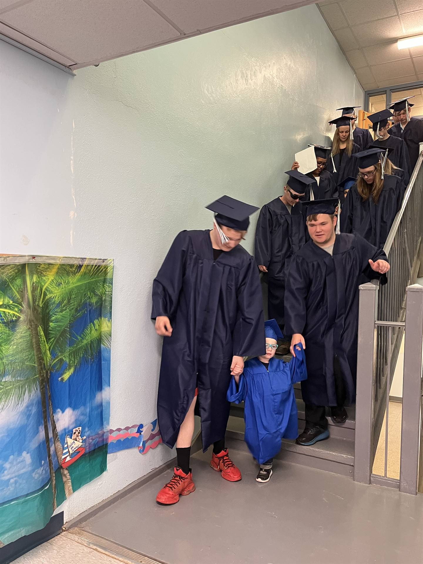 2023 Senior graduates in the hallway of their primary school