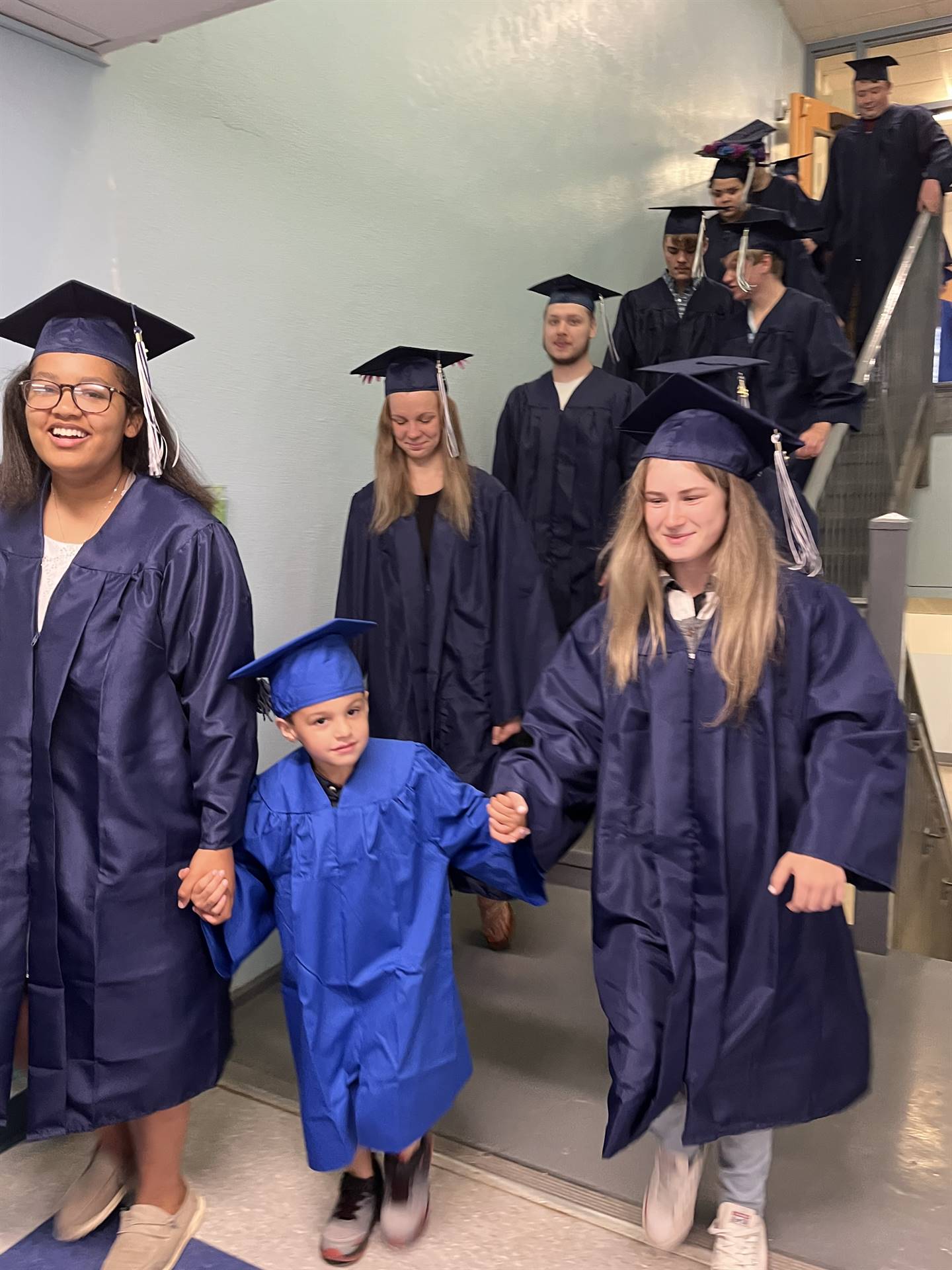 2023 Senior graduates in the hallway of their primary school