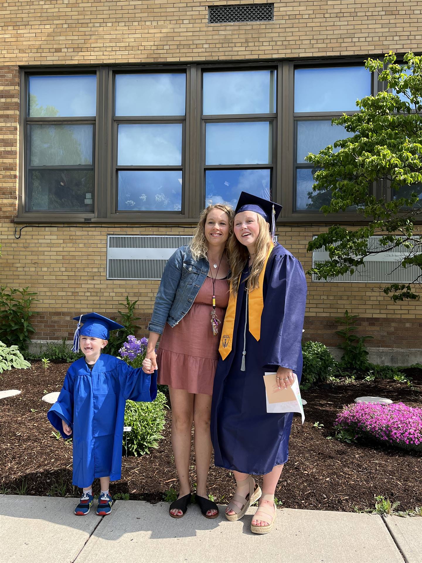 A 2023 Graduate with her mom and a pre k graduate