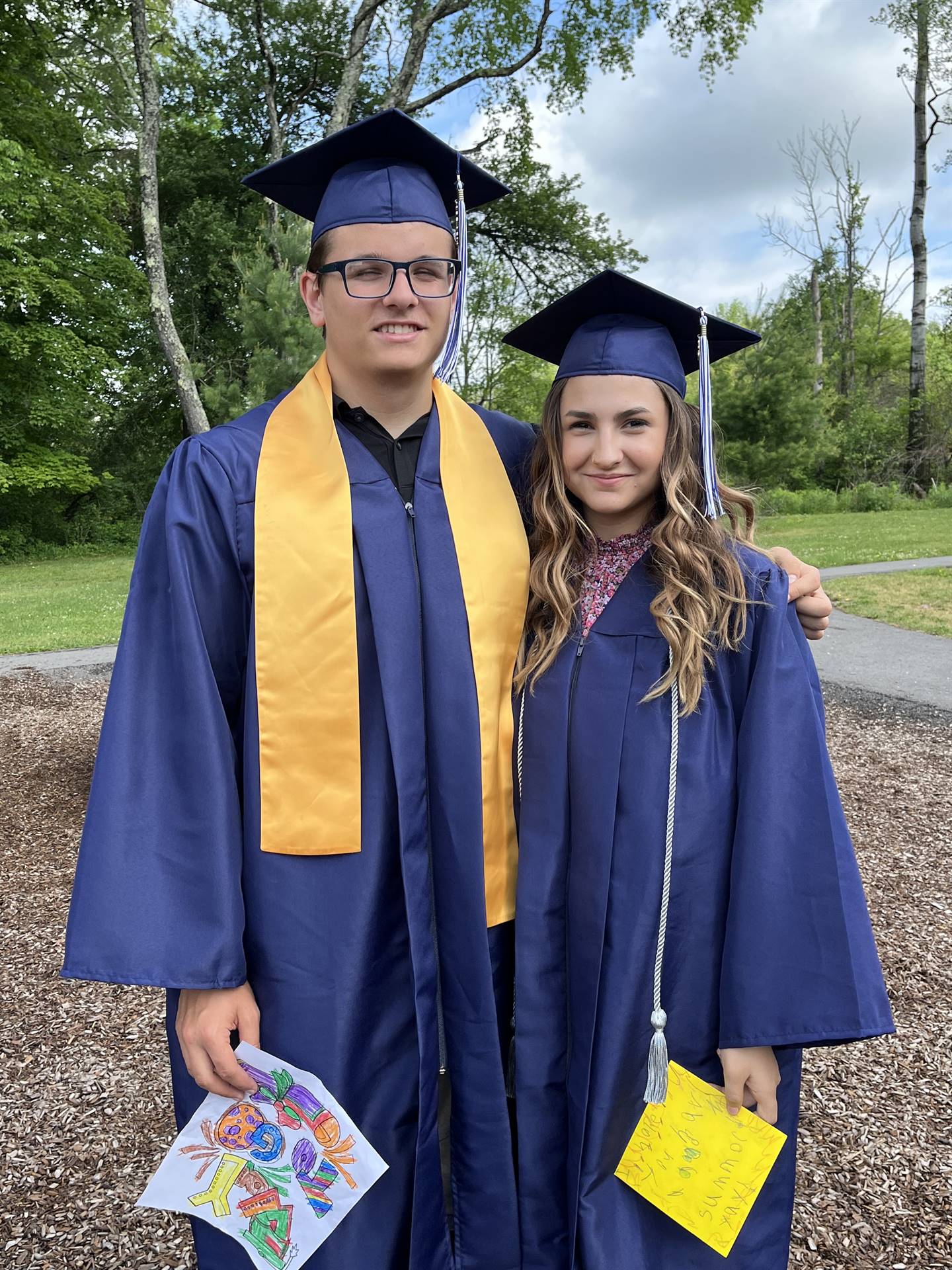 2 senior graduates on playground