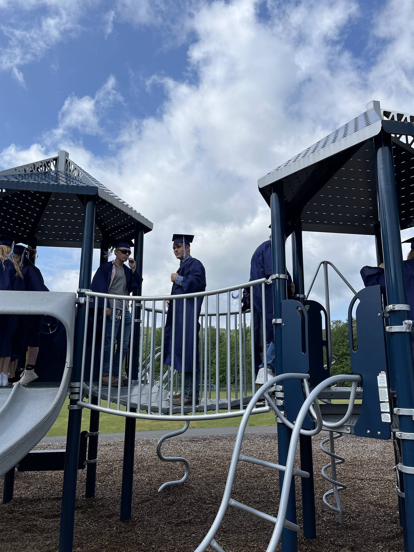 Senior graduates on playground bridge