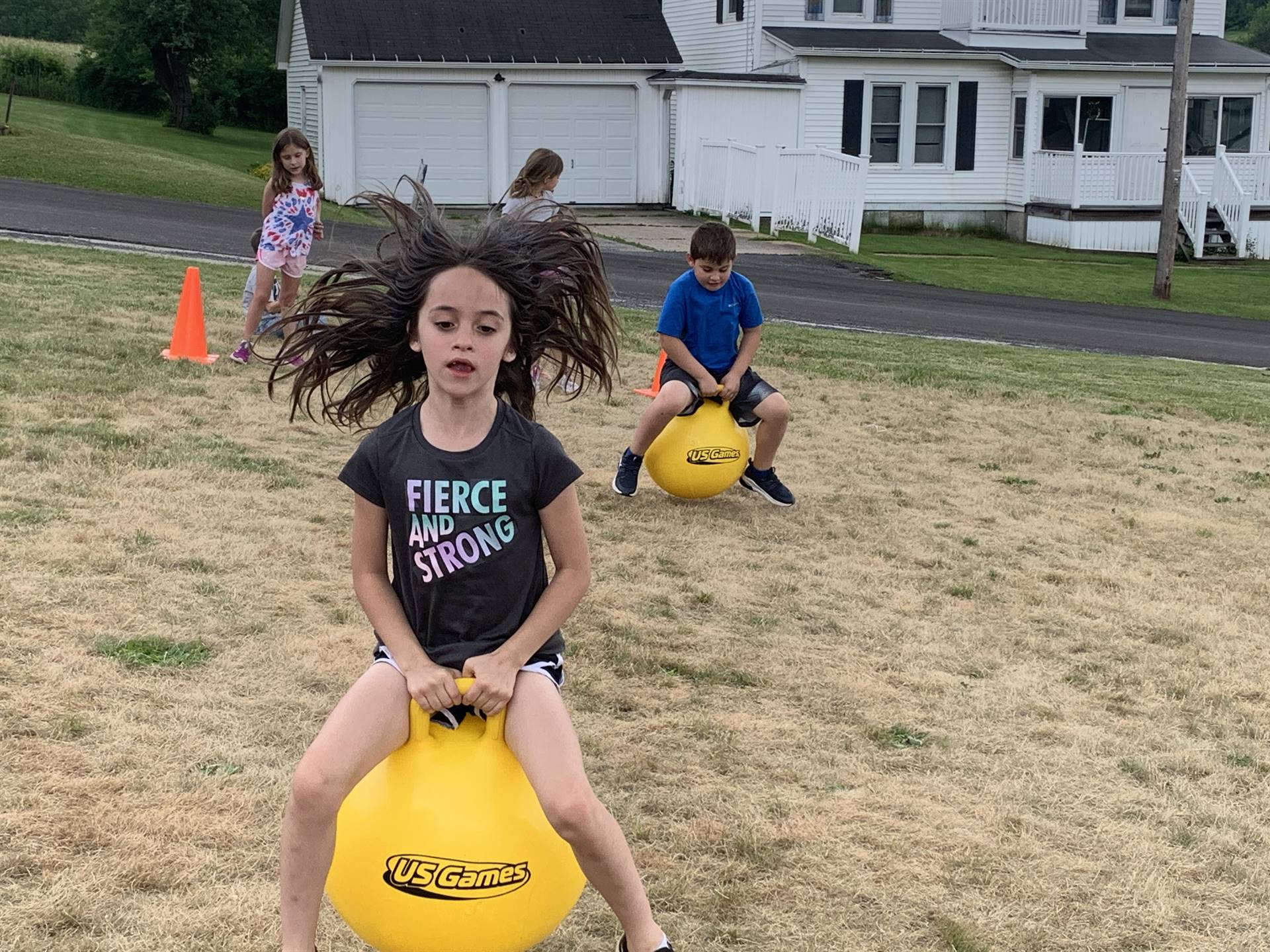 child on a yellow jump ball
