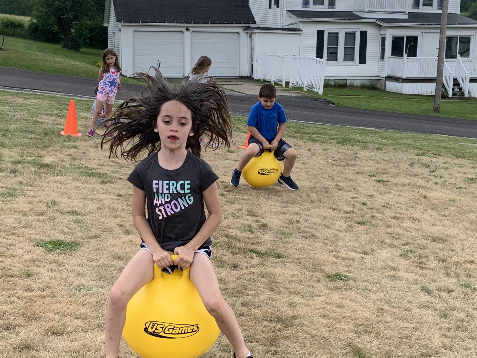 child on a yellow jump ball