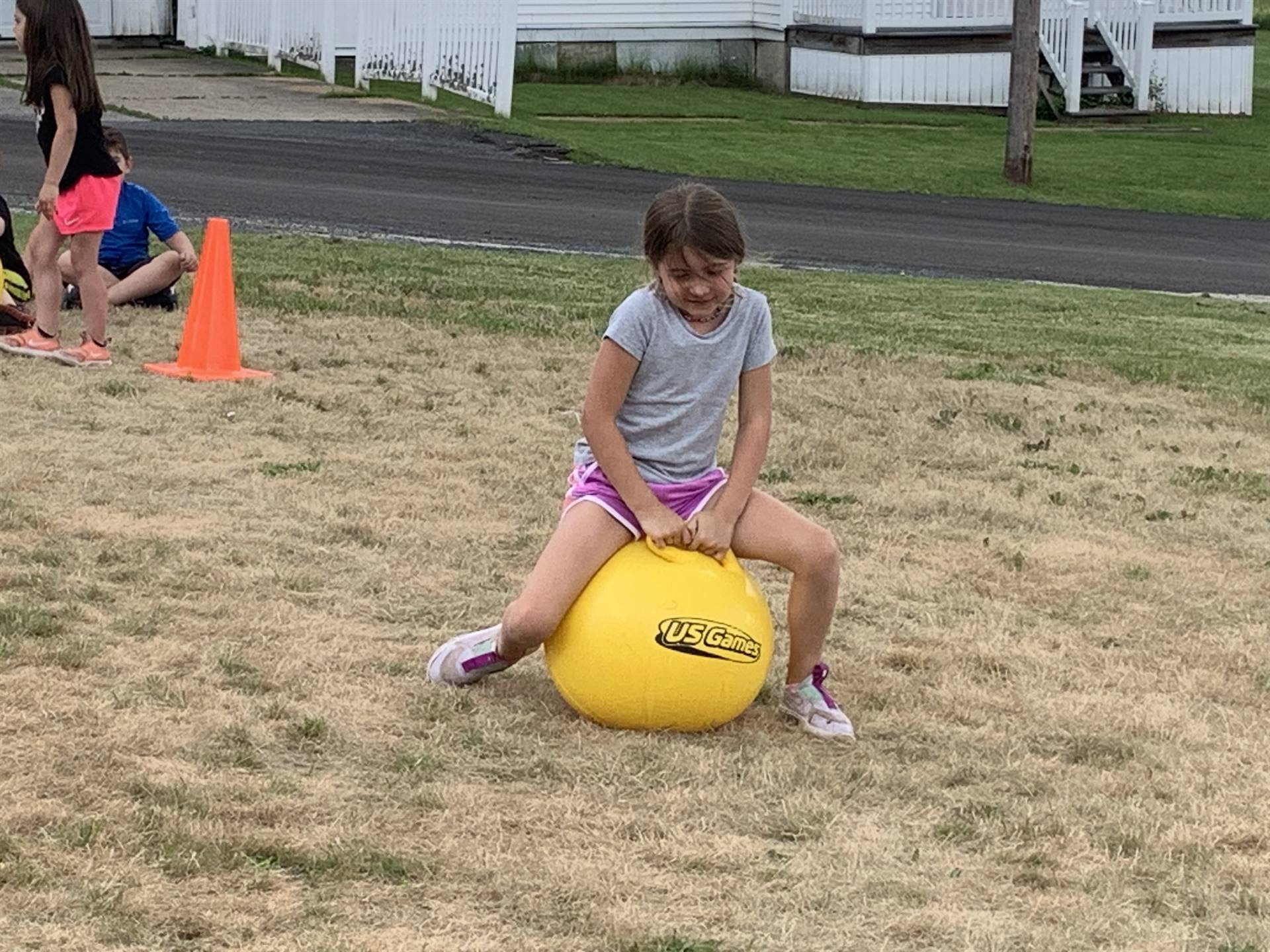 child on a yellow jump ball