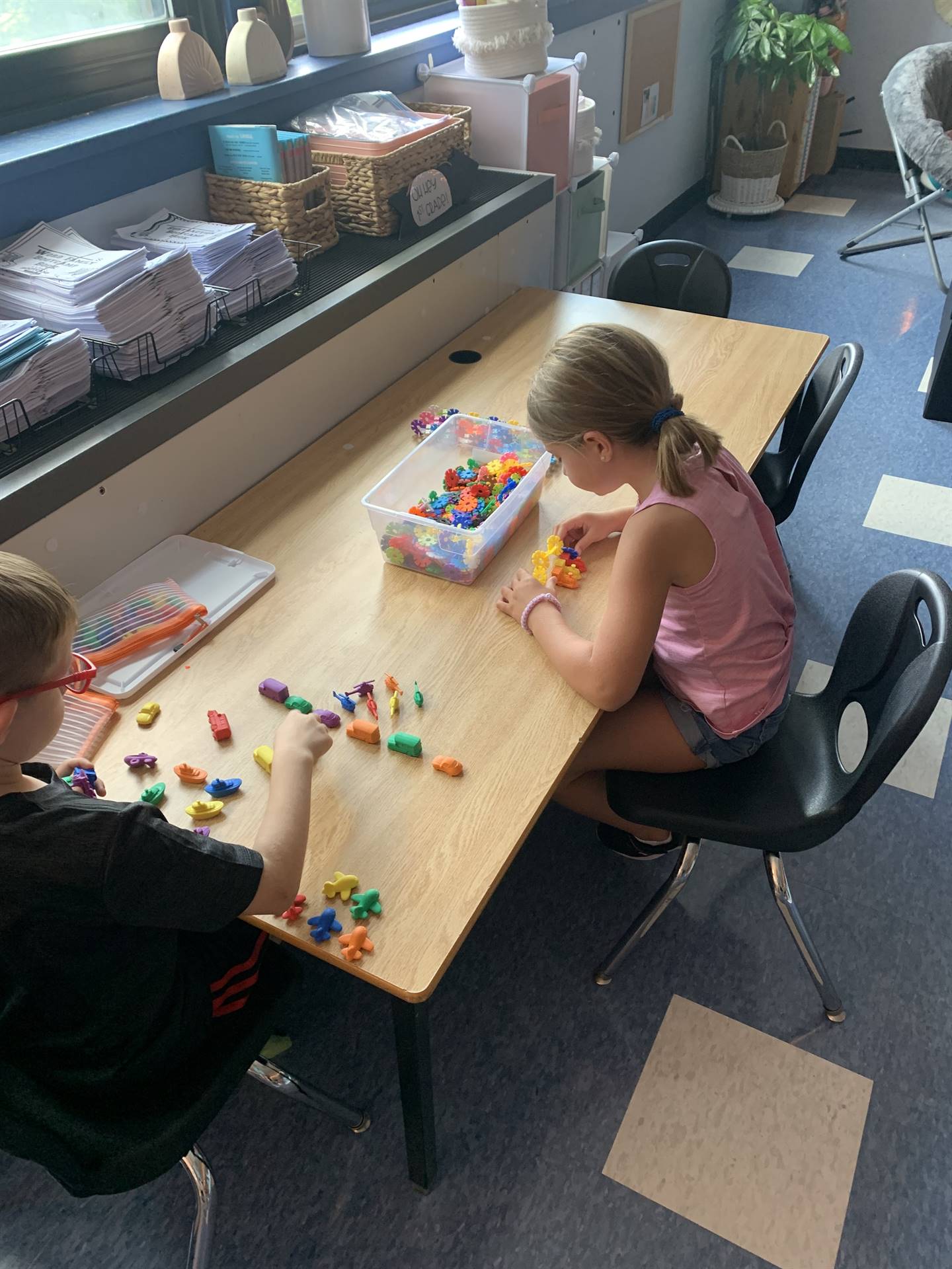  students playing with toys