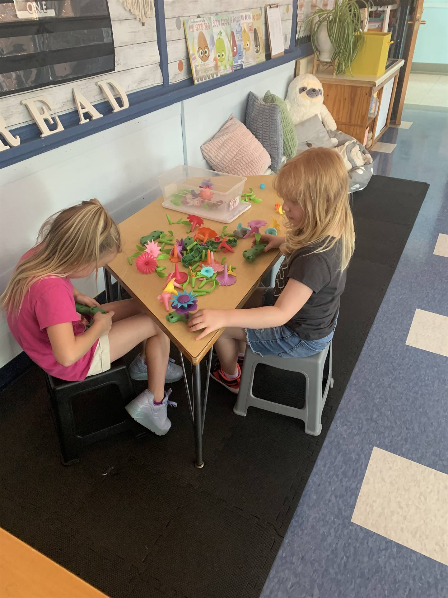 2 students playing with toys