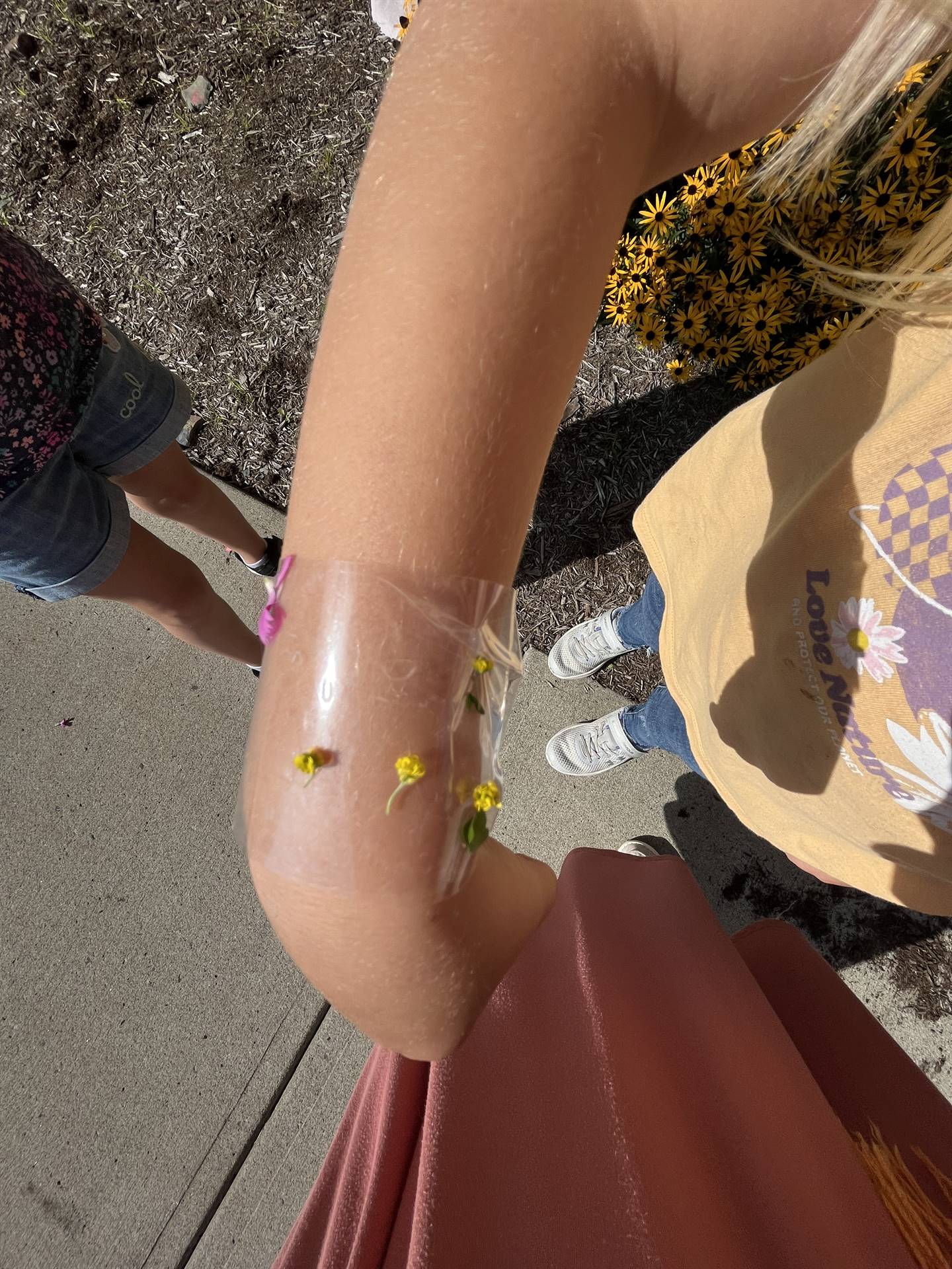 A home made nature bracelet on a student's wrist