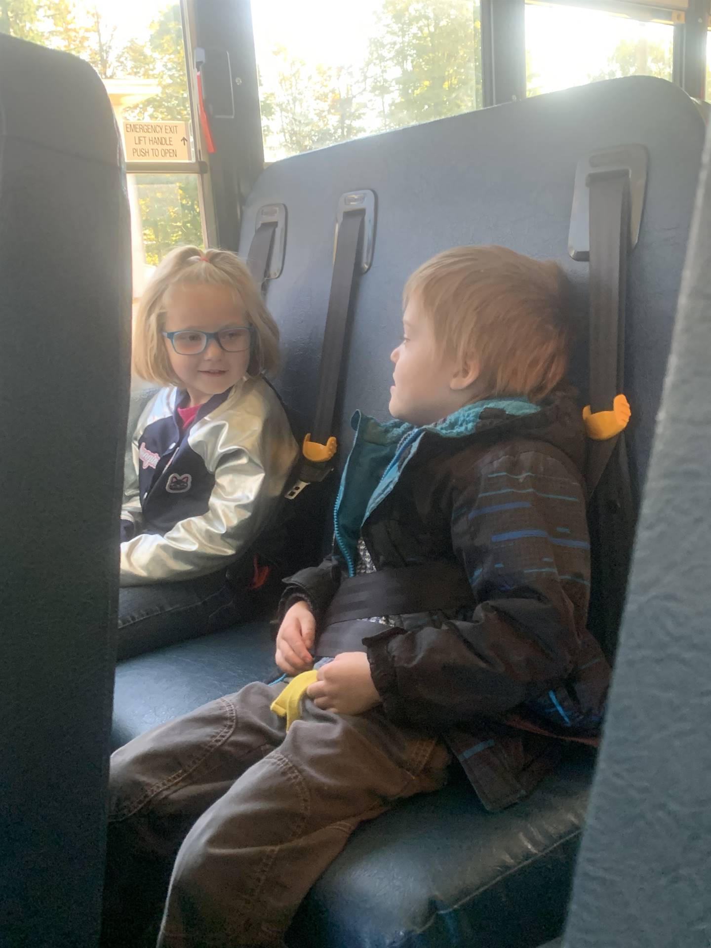 2 kids on a bus