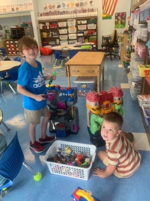 2 students playing with toys