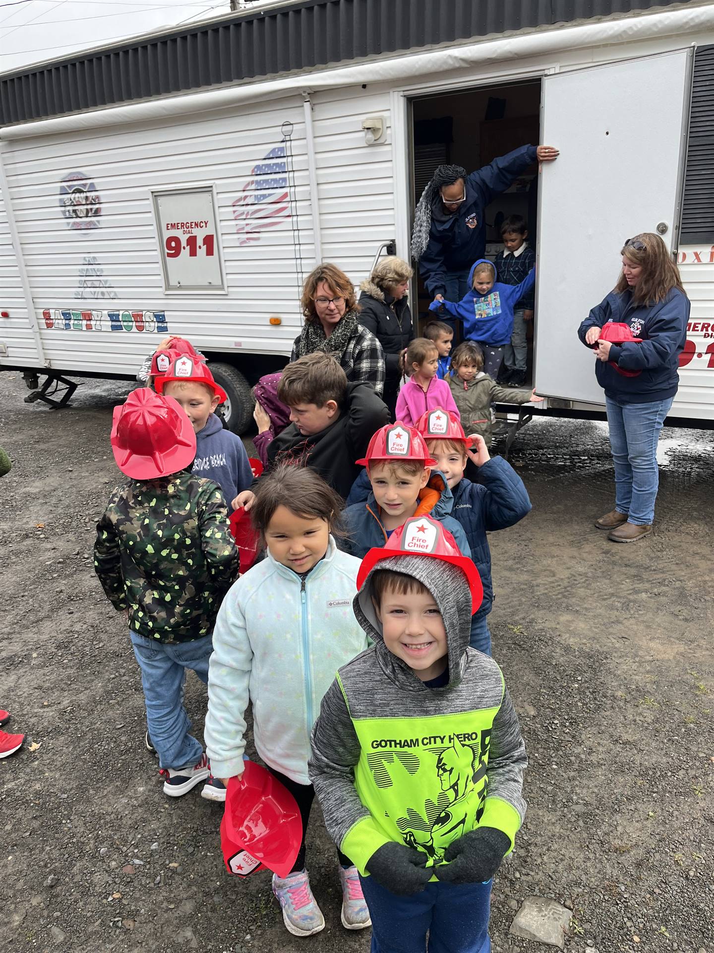 students with red firehats on.