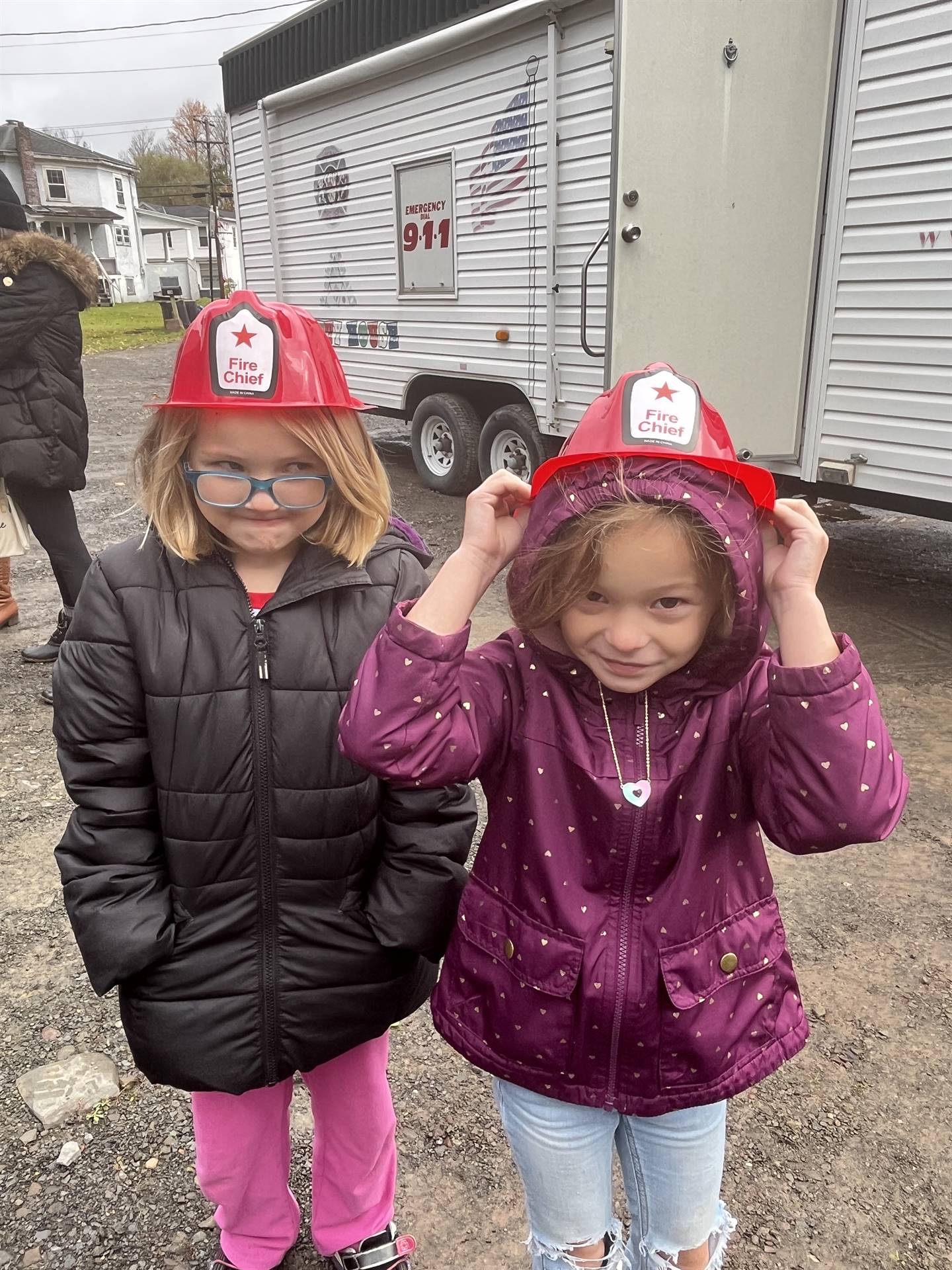 2 students with fire hats on.