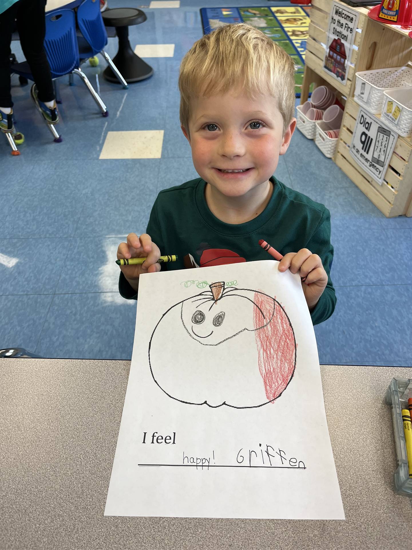 student with a paper pumpkin with happy emotion