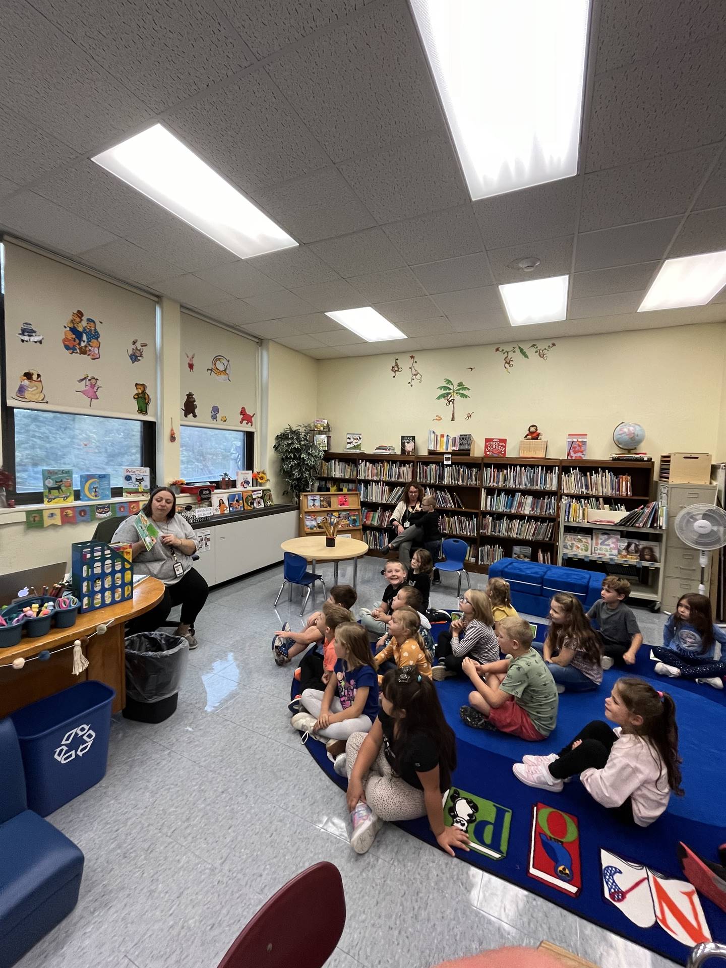 students in library listening to story