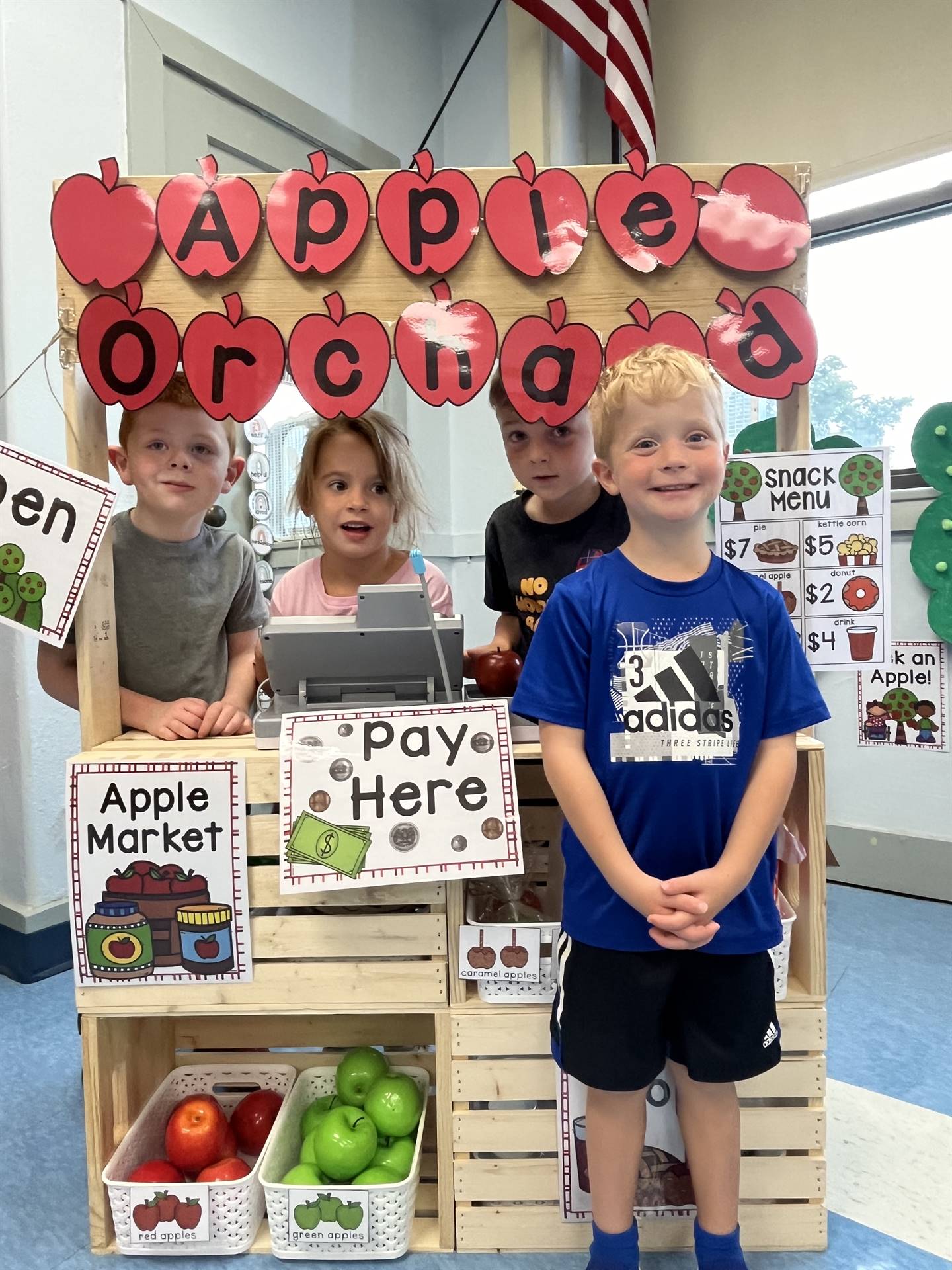 students in apple orchard center