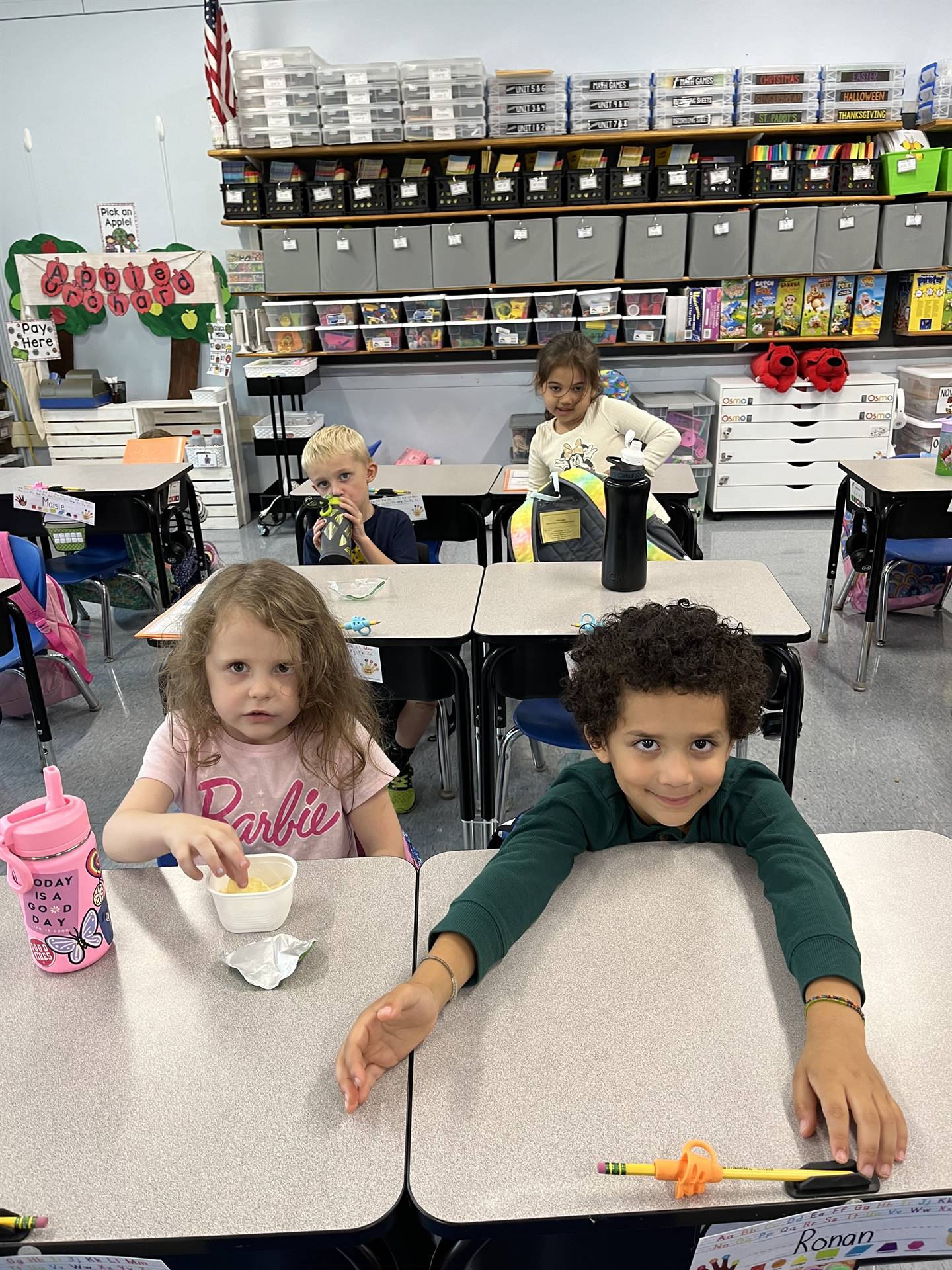 2 students sitting at desks