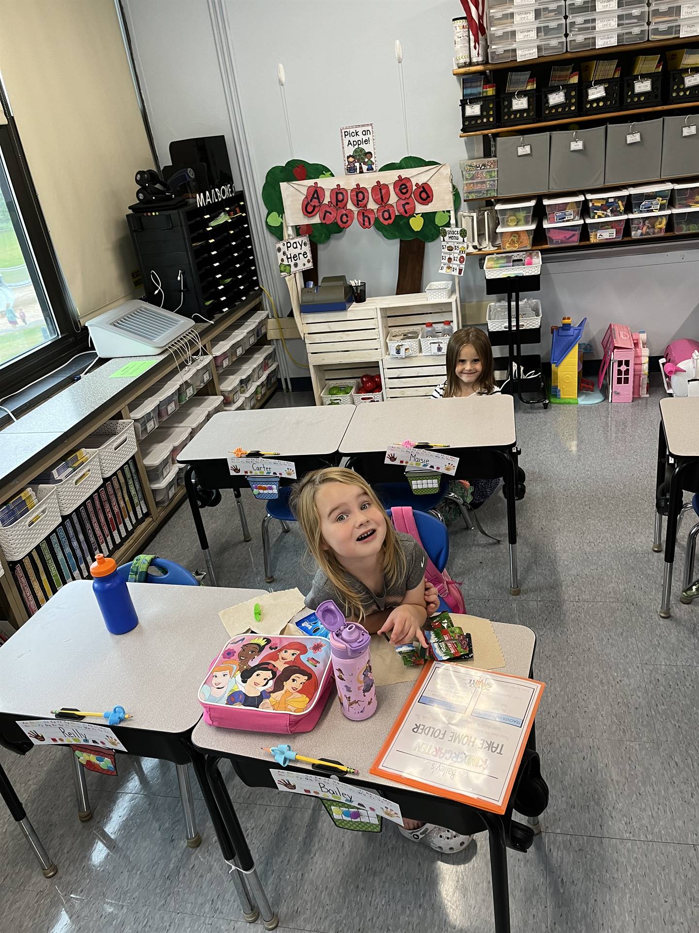 student eating snack at desk