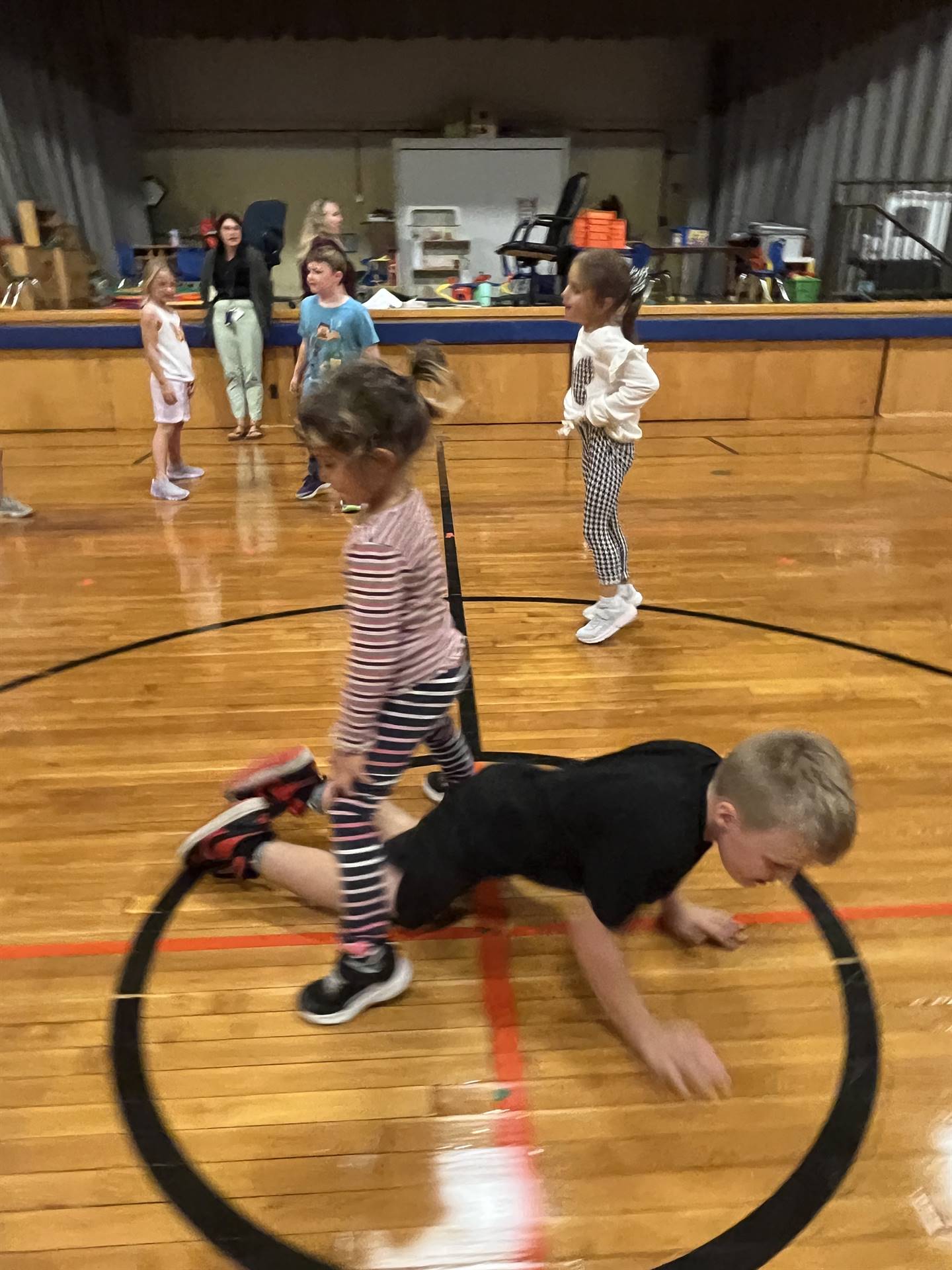 Tag games and student crawls under another student