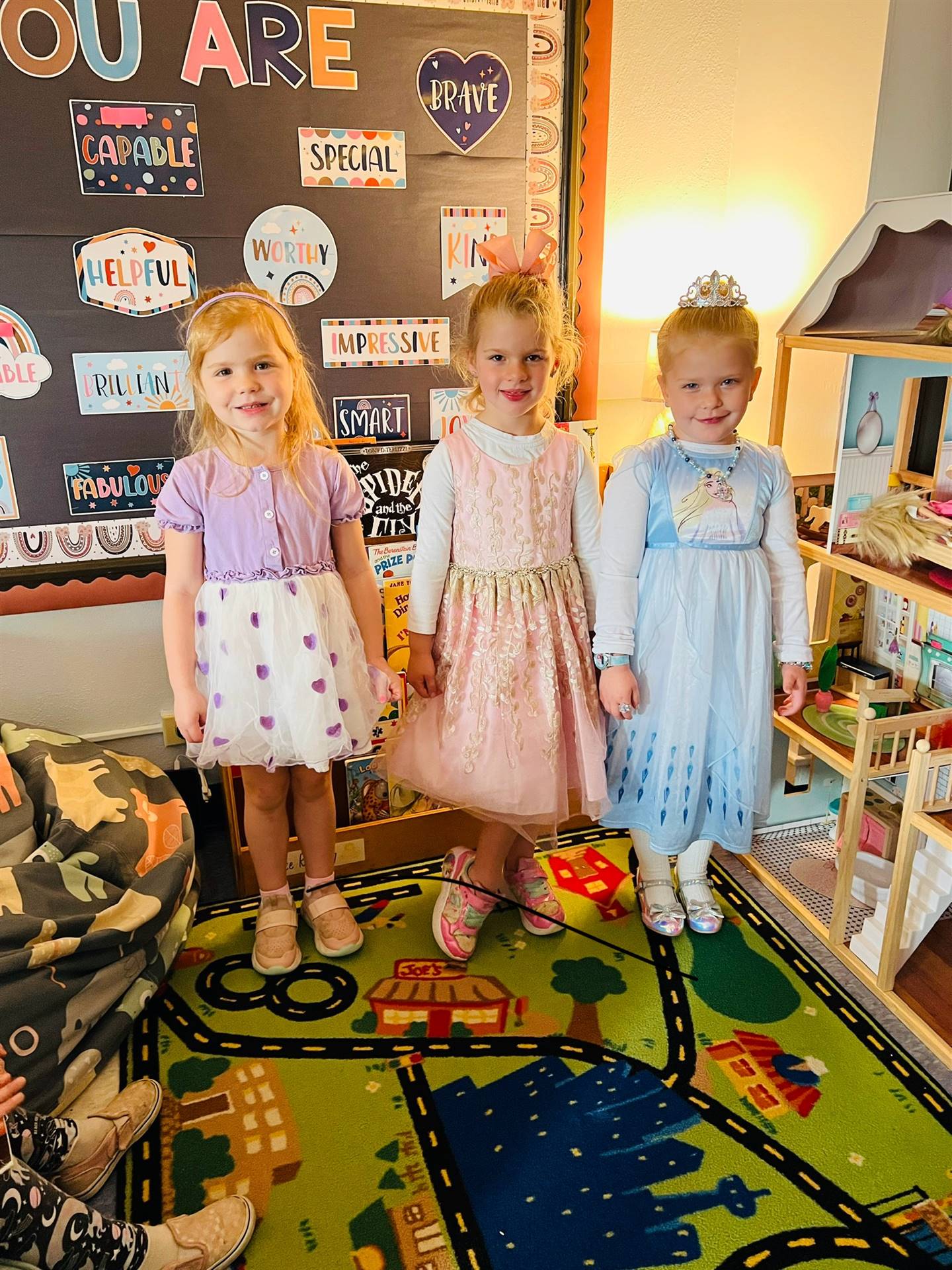 3 kids dressed in fancy clothes