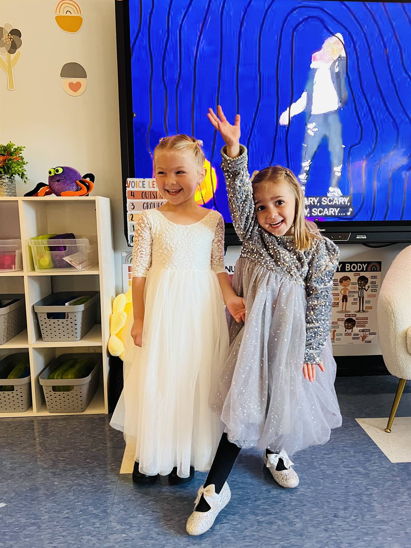 2 kids dressed in fancy dresses