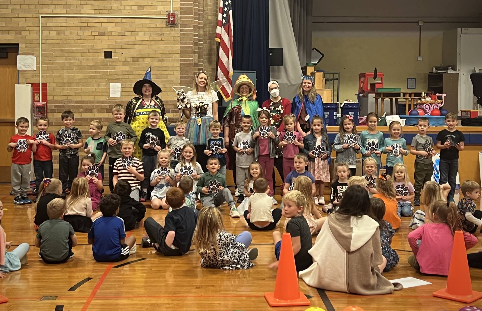 School wide paws assembly with PAWS characters.