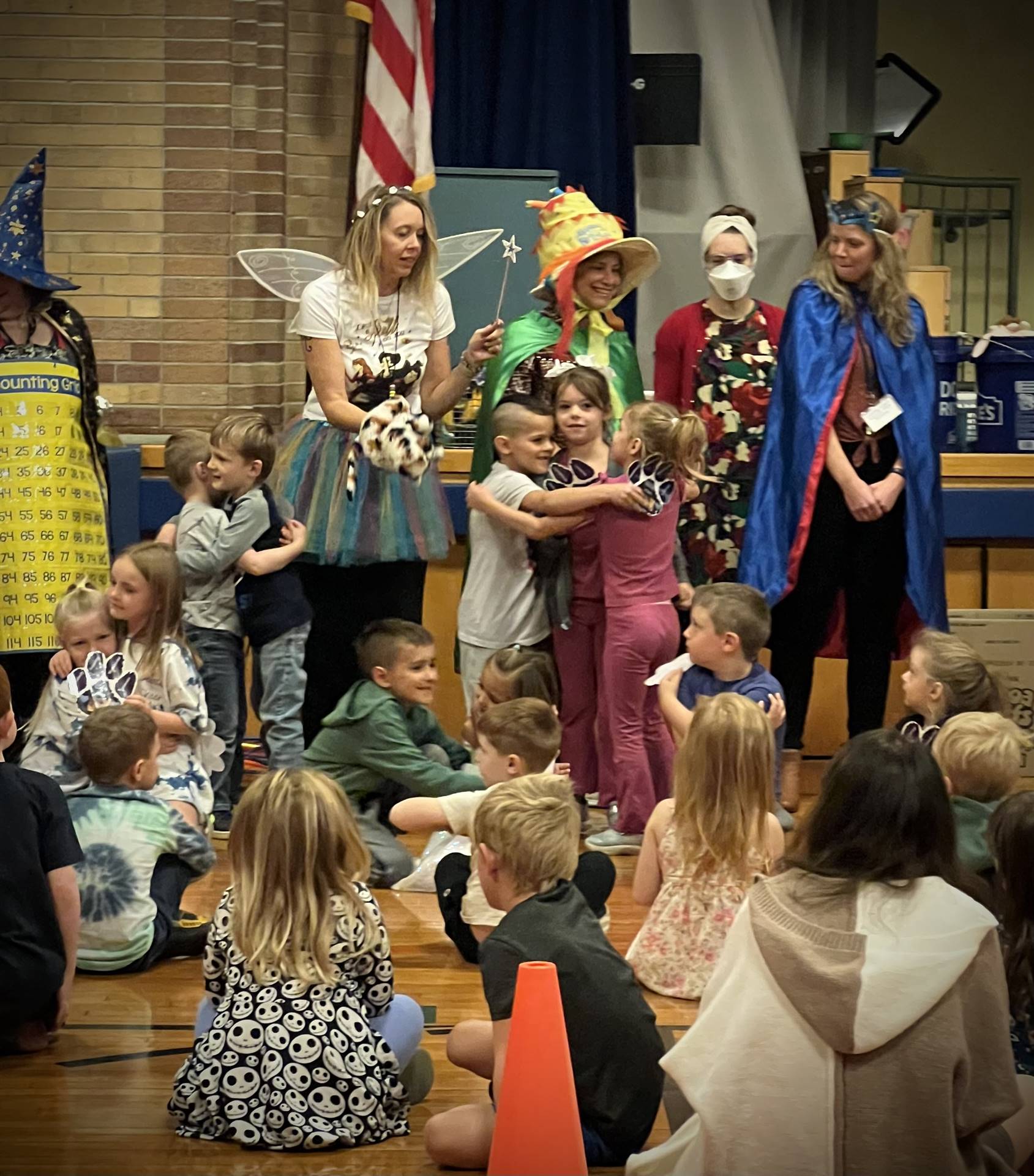 School wide paws assembly with PAWS characters.