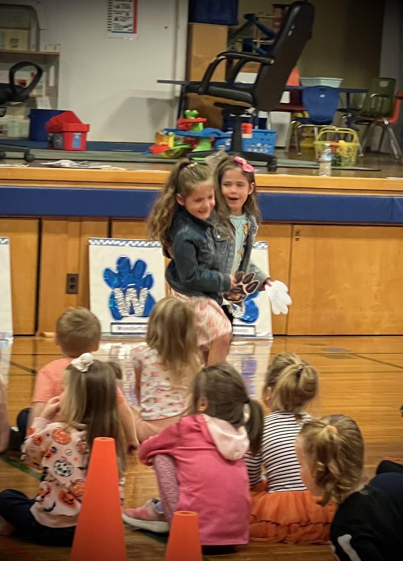 2 students give each other a hug