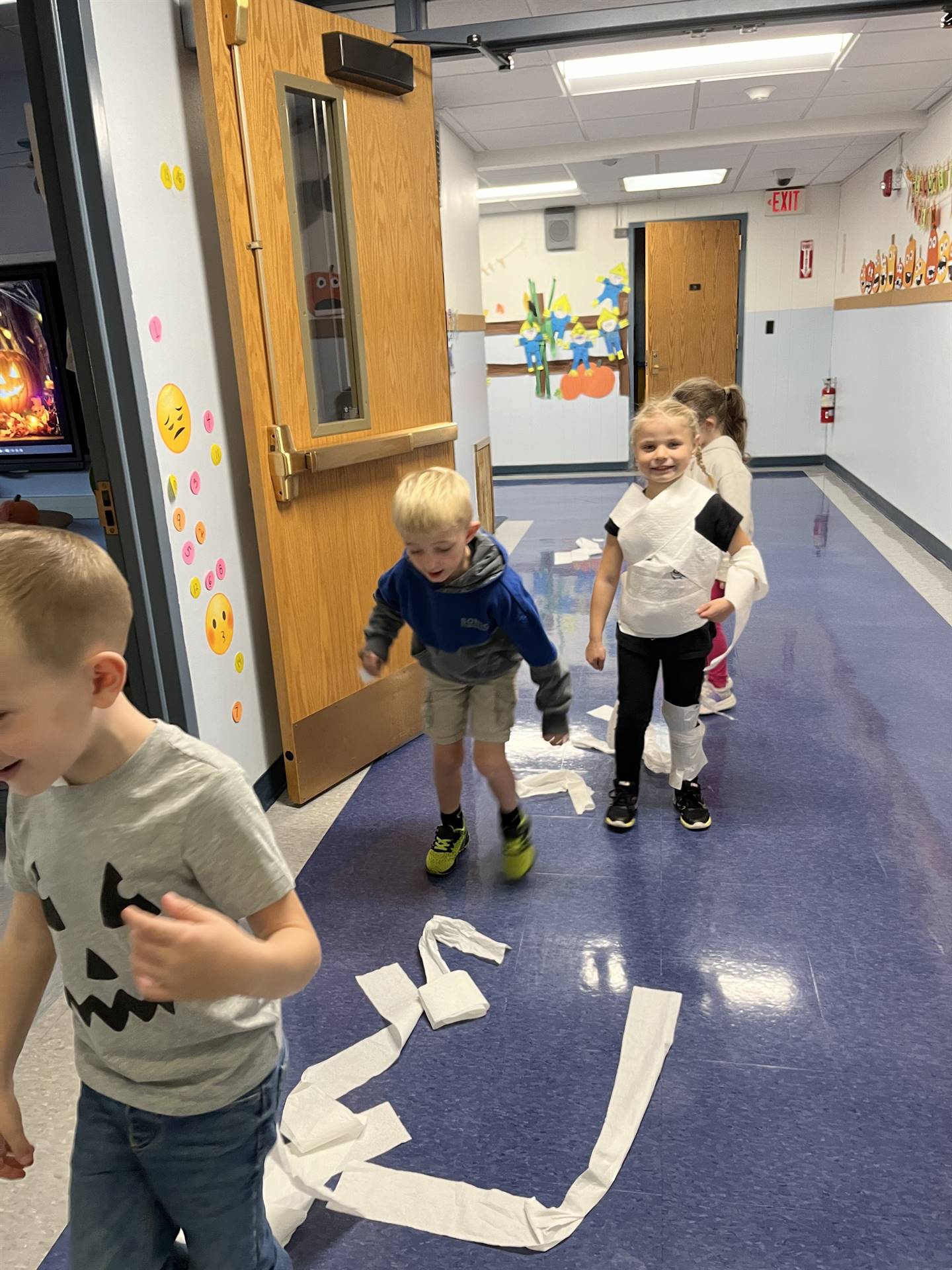 kids wrapped in toilet paper