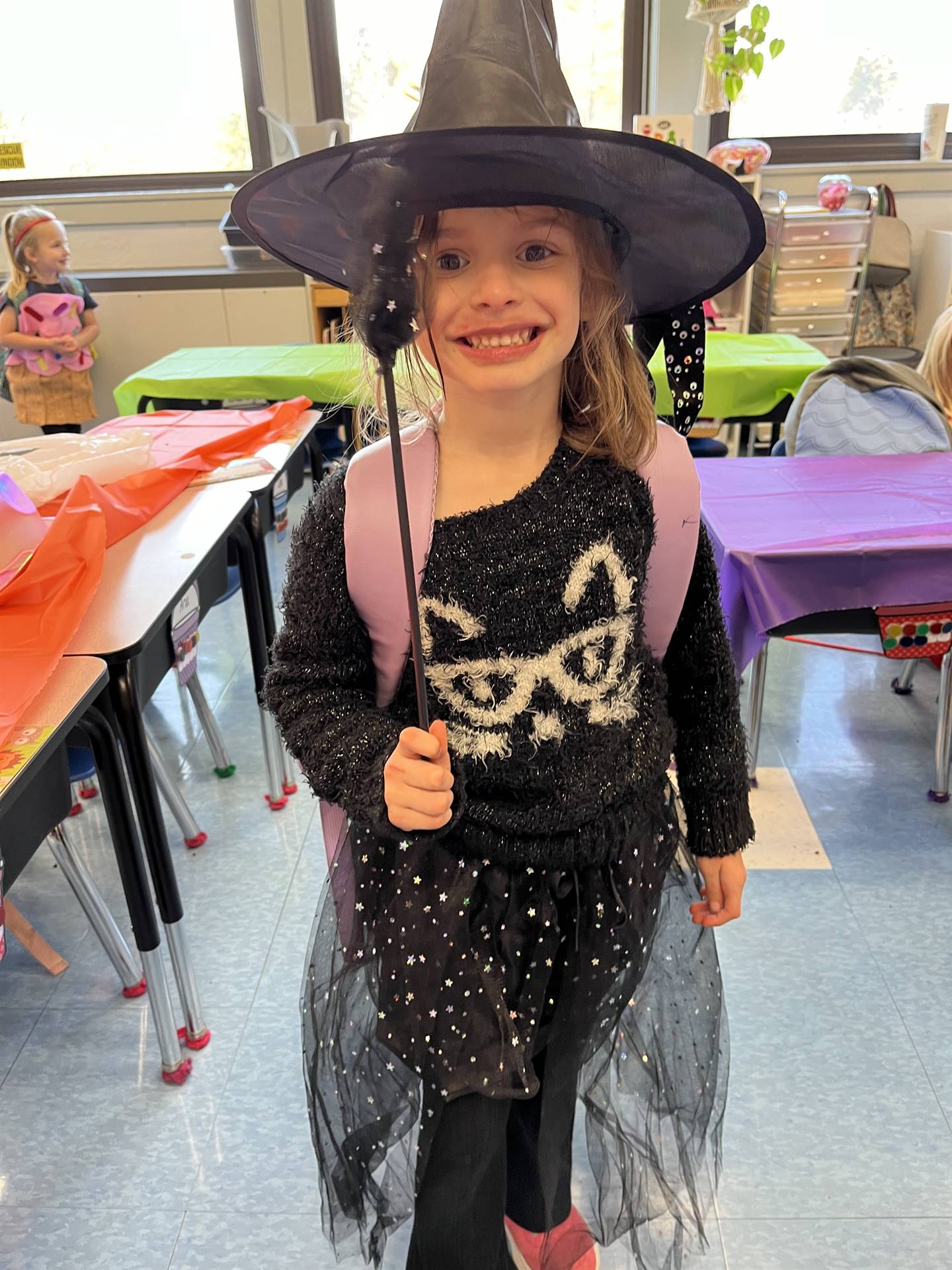 a black witch costume with pointy black hat.