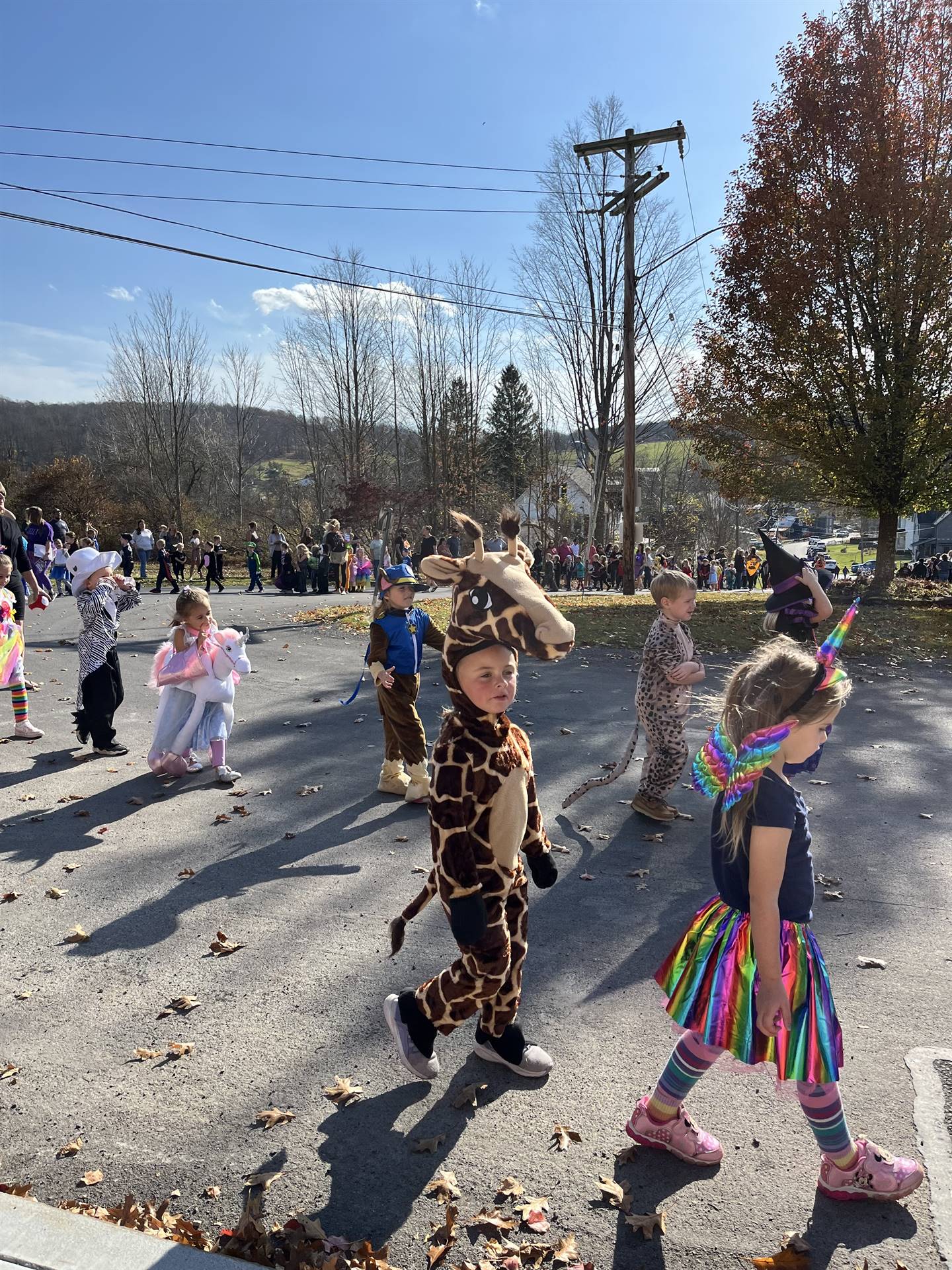 students marching in halloween parade outdoors!