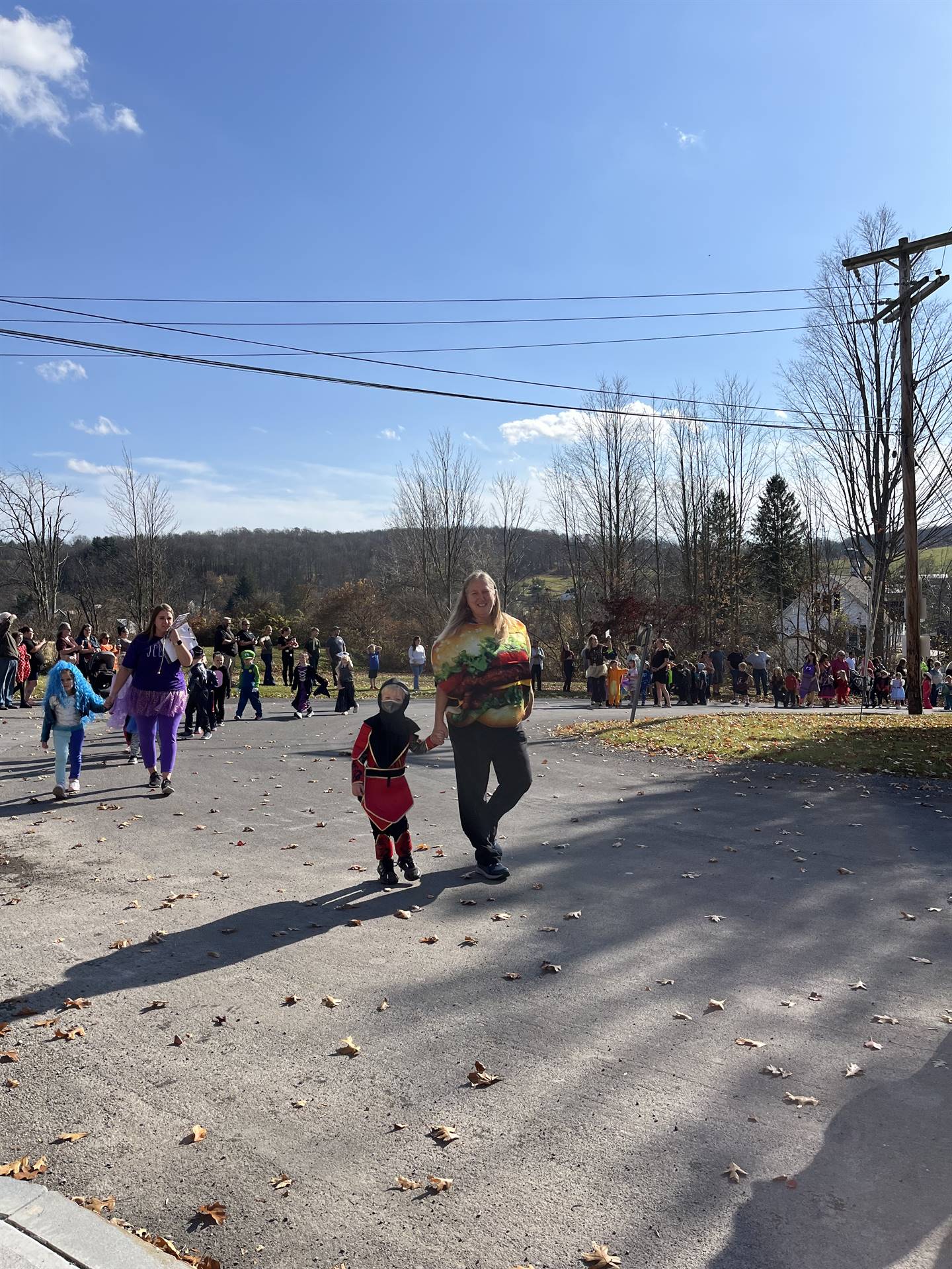 students marching in halloween parade outdoors!