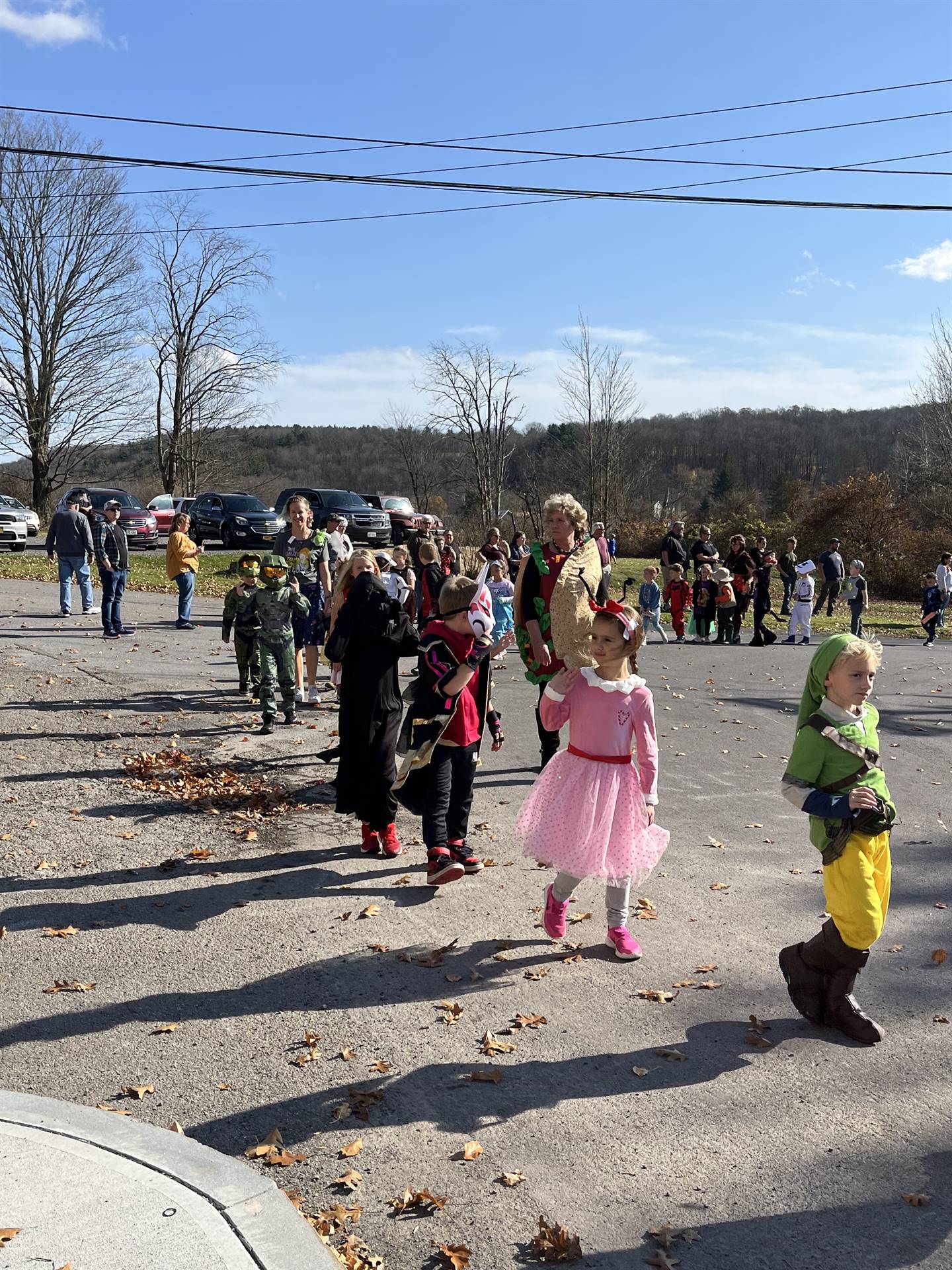 students marching in halloween parade outdoors!