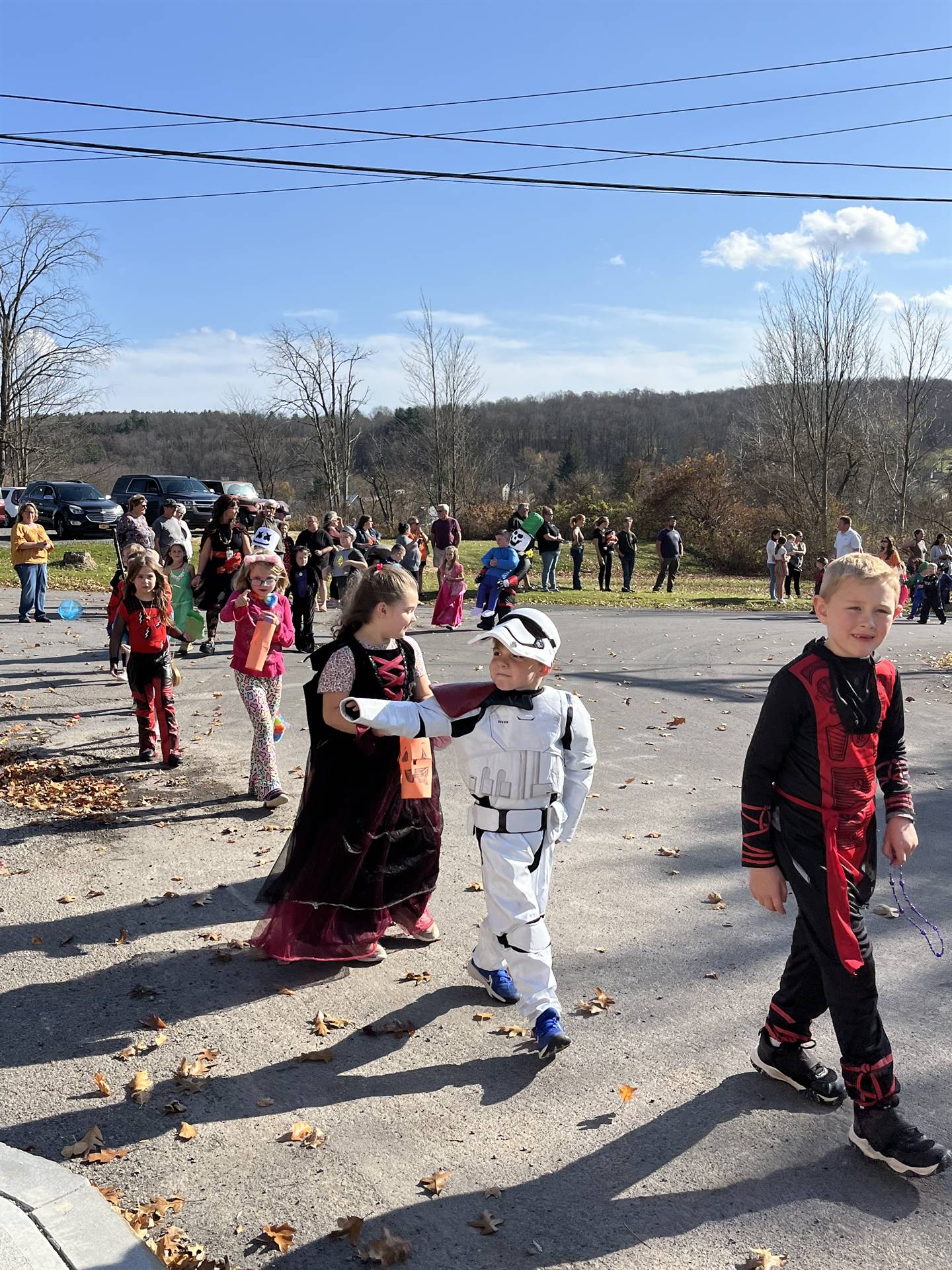students marching in halloween parade outdoors!