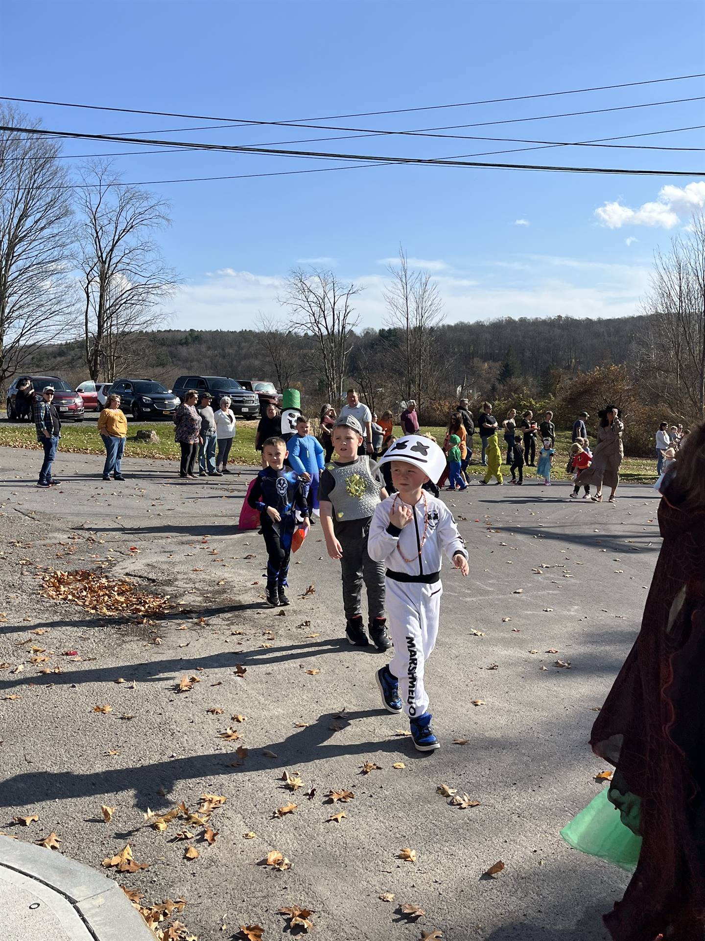 students marching in halloween parade outdoors!