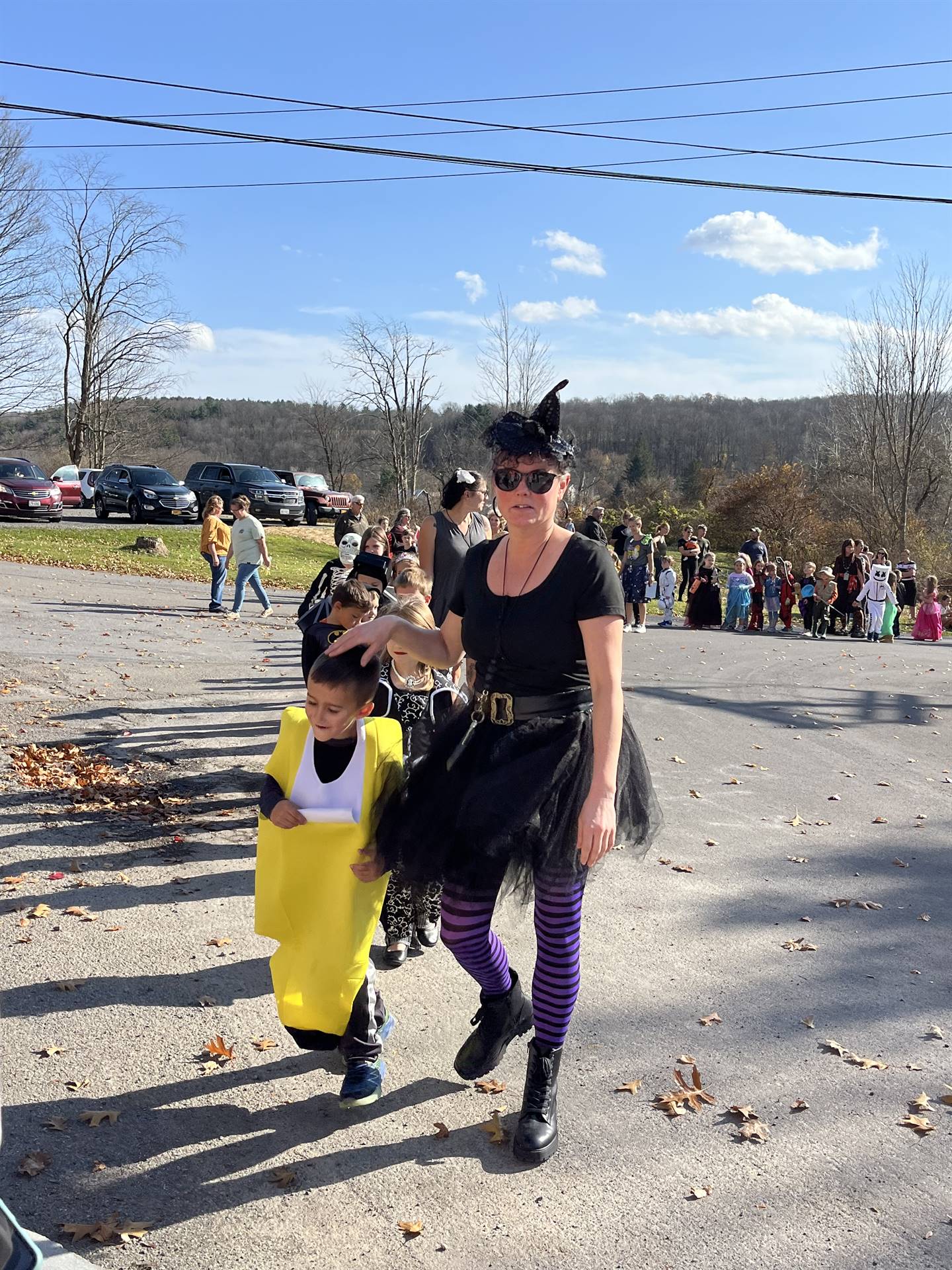 students marching in halloween parade outdoors!