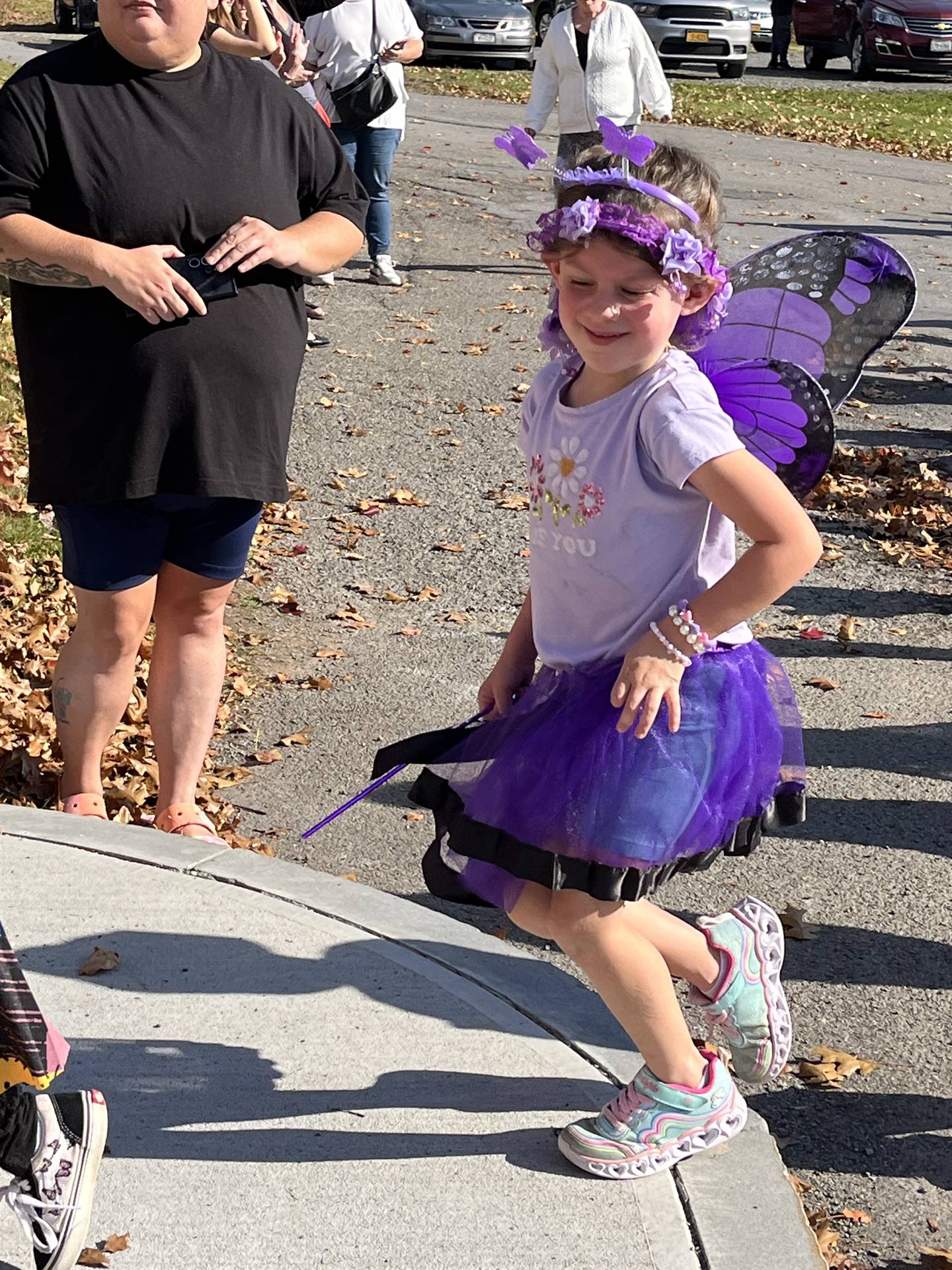a student dressed as a purple butterfly