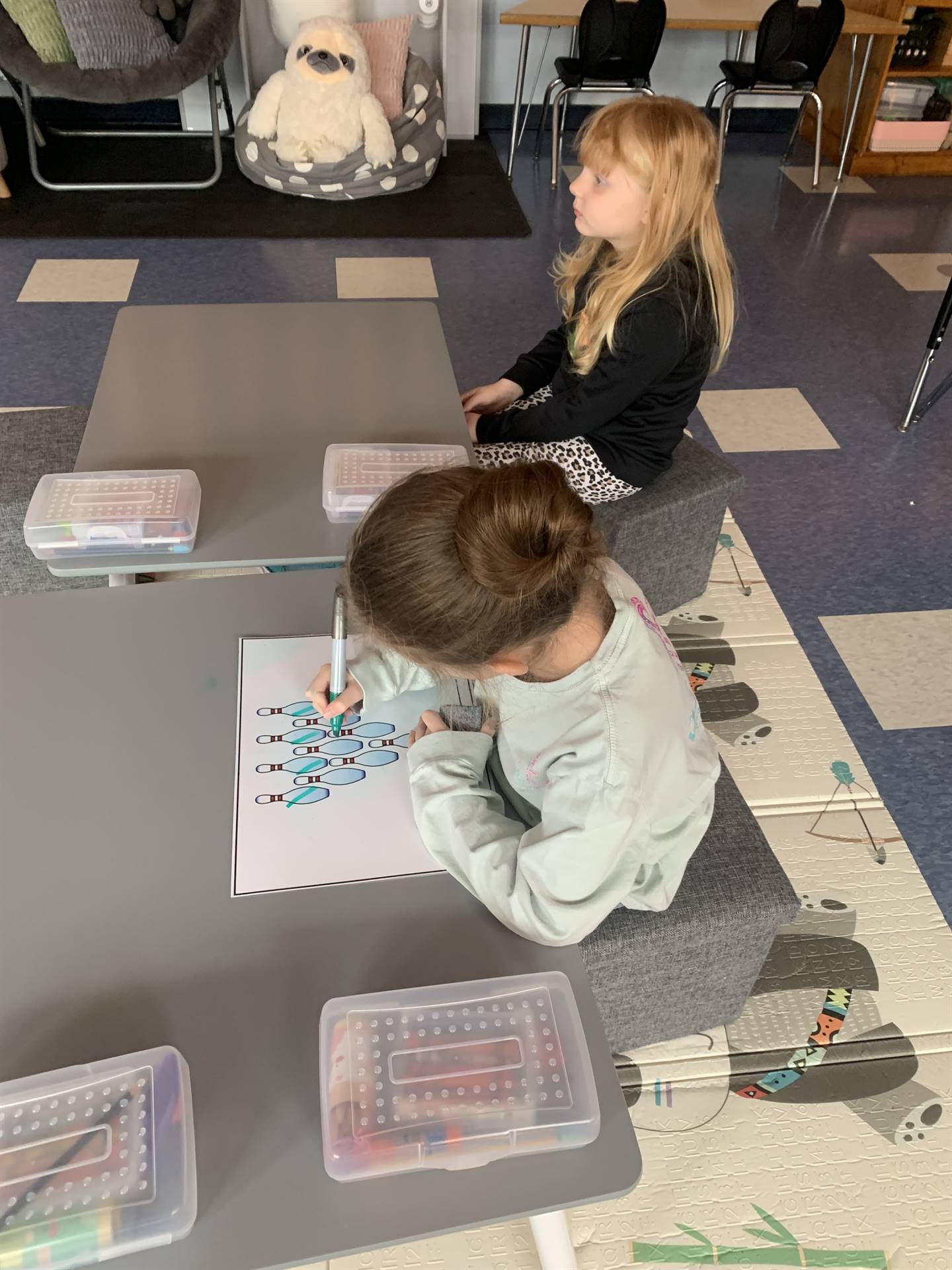 2 students working on floor