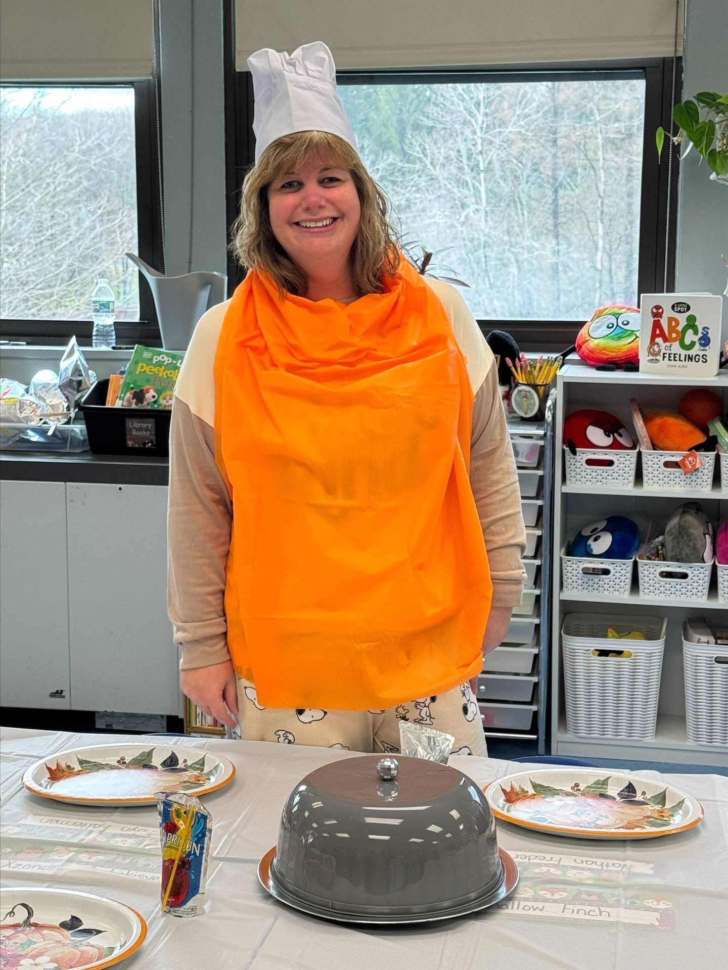 The teacher chef with orange bib and chef hat!