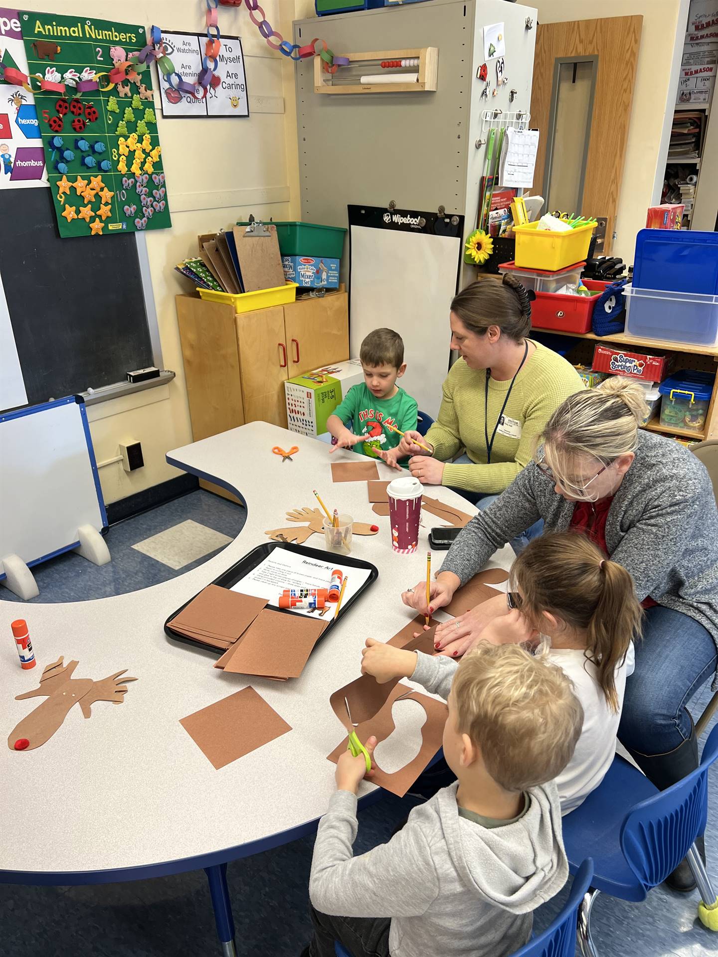 adults and students crafting together