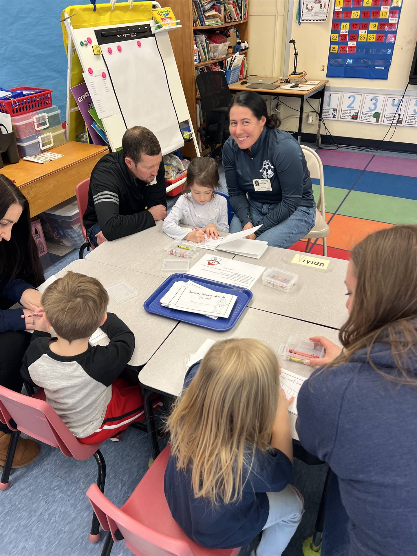 adults and students crafting together
