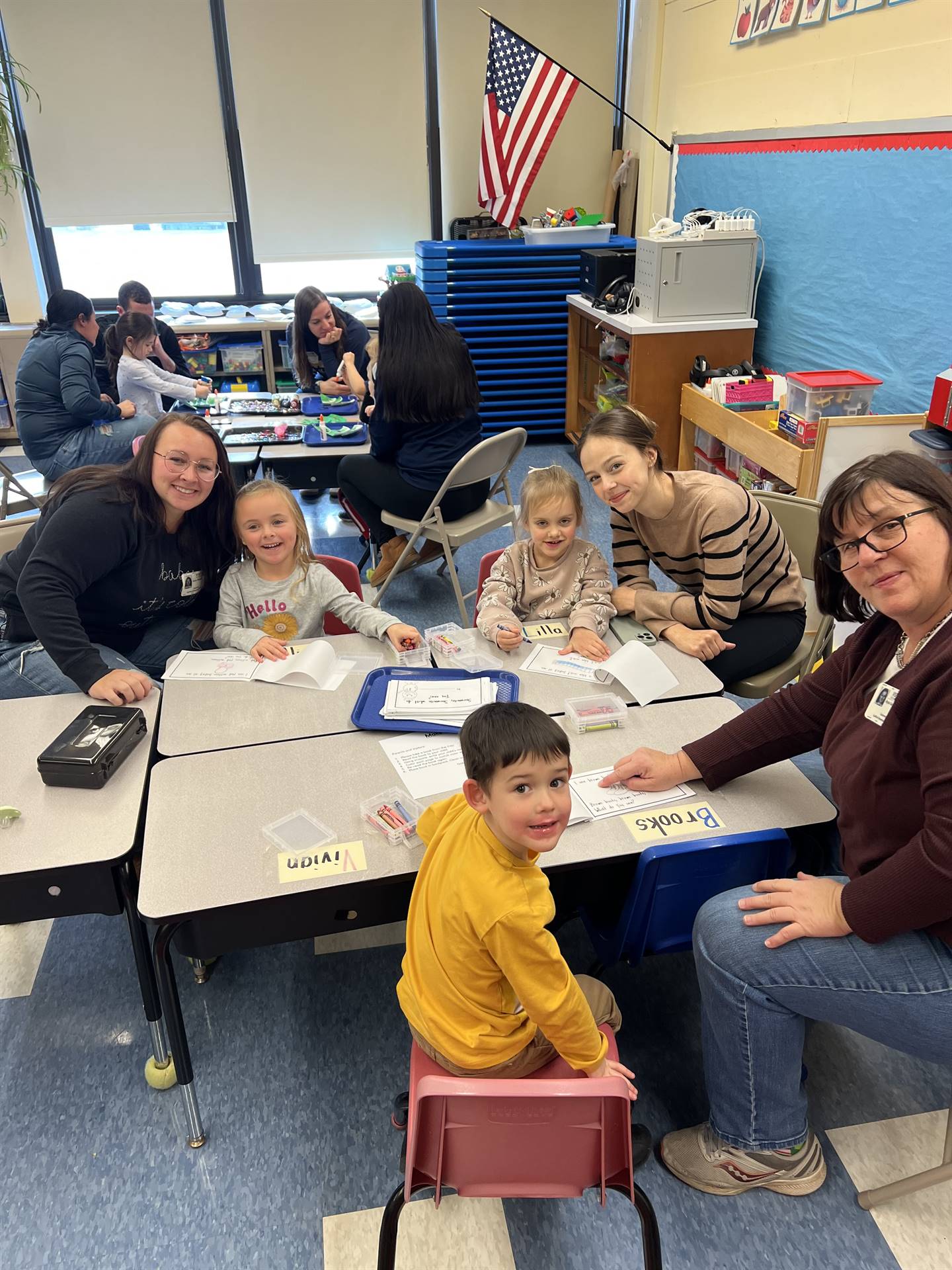 adults and students crafting together